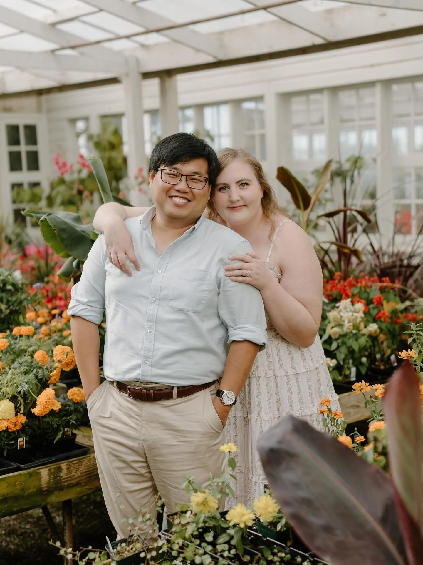 Megan &amp; Jae&rsquo;s engagement session at Christianson&rsquo;s Nursery last summer!!! I&rsquo;m still not over Megan&rsquo;s floral embroidered dress 🤩🥰 so whimsical &amp; dreamy. I can&rsquo;t wait to celebrate with these two at their wedding 