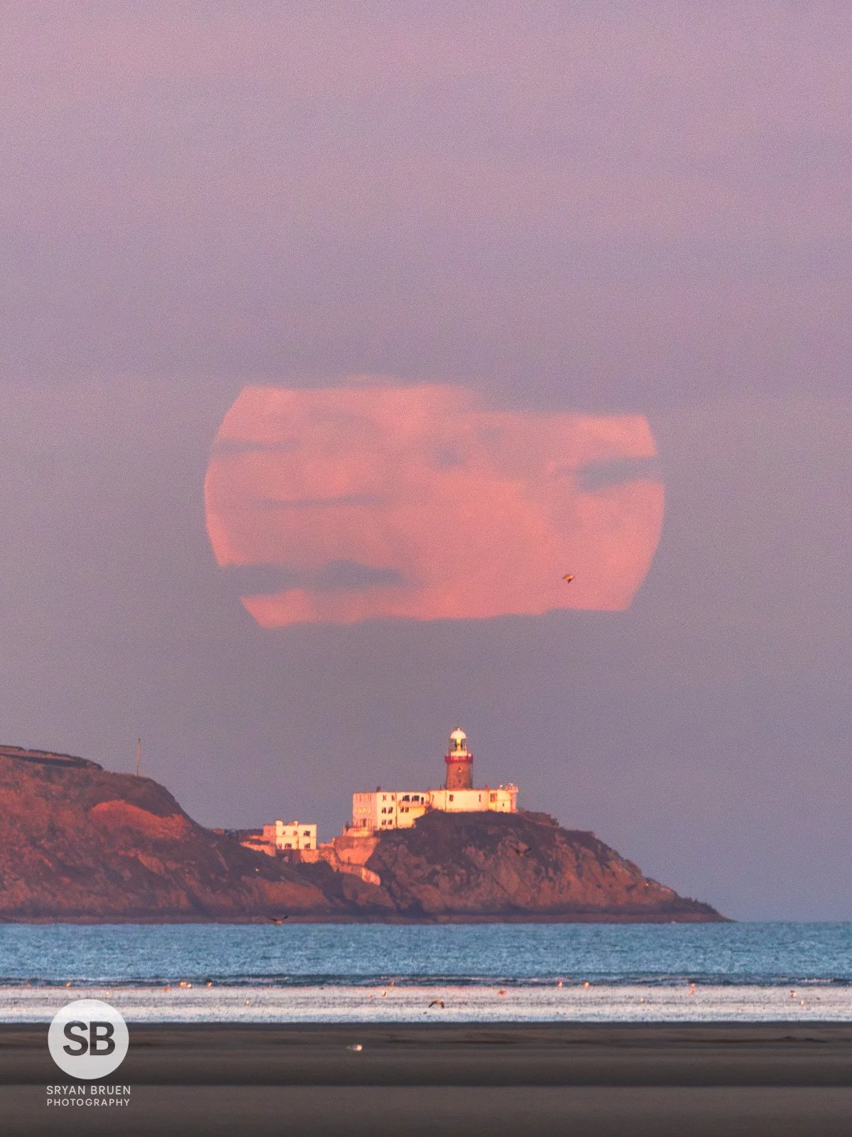 2024-10-17 Moonrise close up over Baily Lighthouse 17 October 2024.jpg