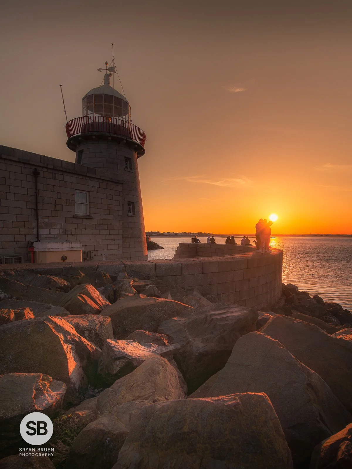 2025-04-11 Howth Lighthouse sunset rocks silhouettes 11 April 2025.jpg