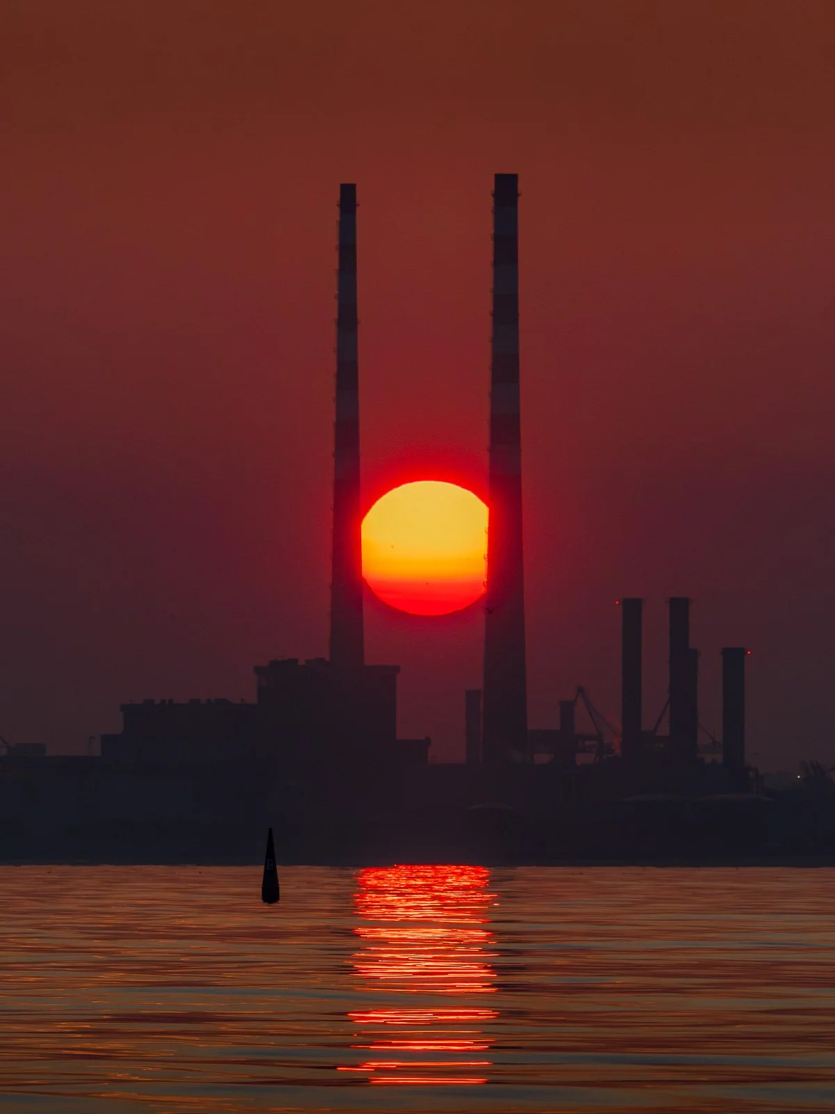 2026-07-16 Poolbeg Chimneys sunset alignment with Goat Boat Tours.jpg