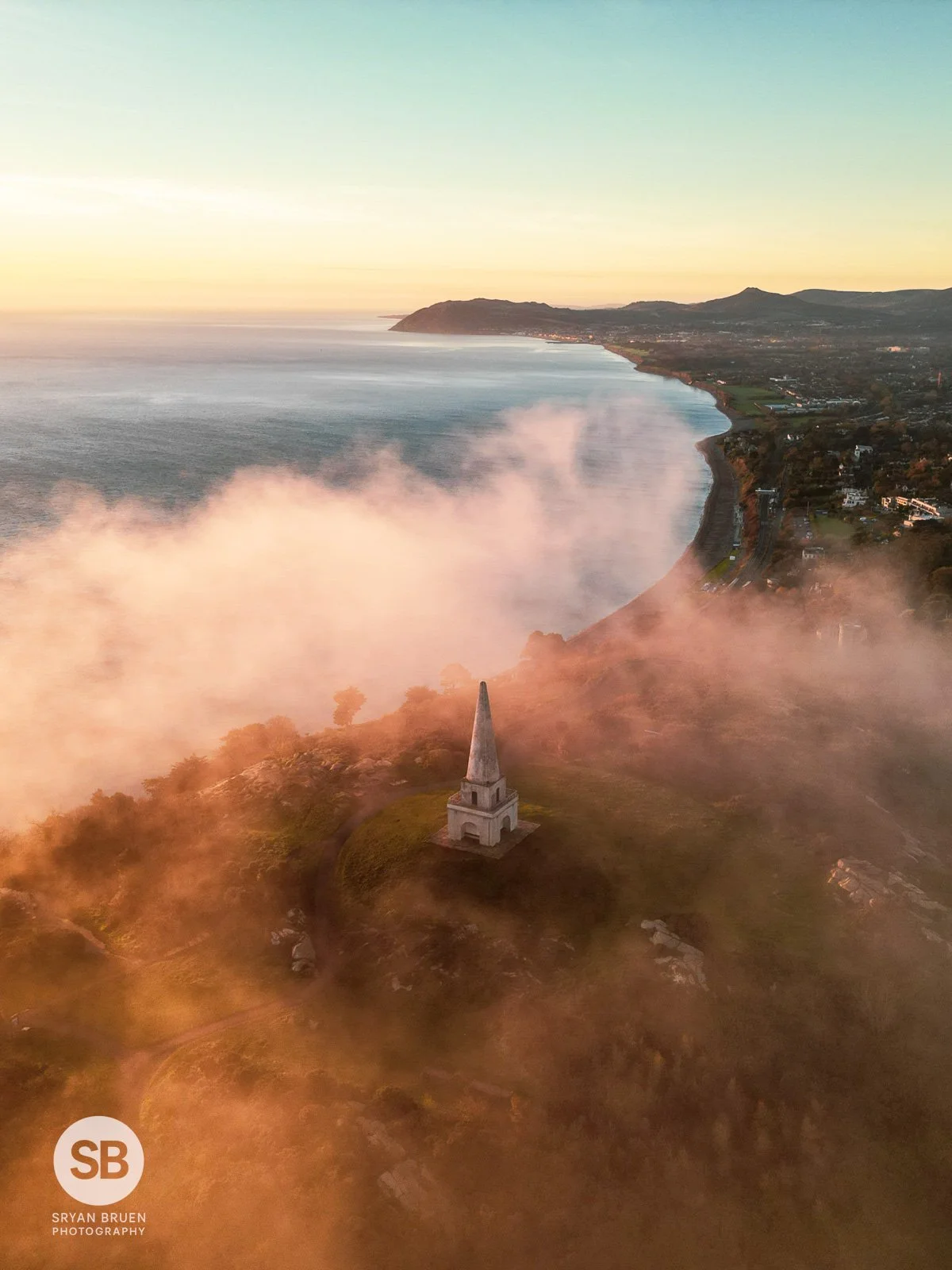 2024-11-13 Killiney Hill obelisk mist vertical sunrise 13 November 2024.jpg