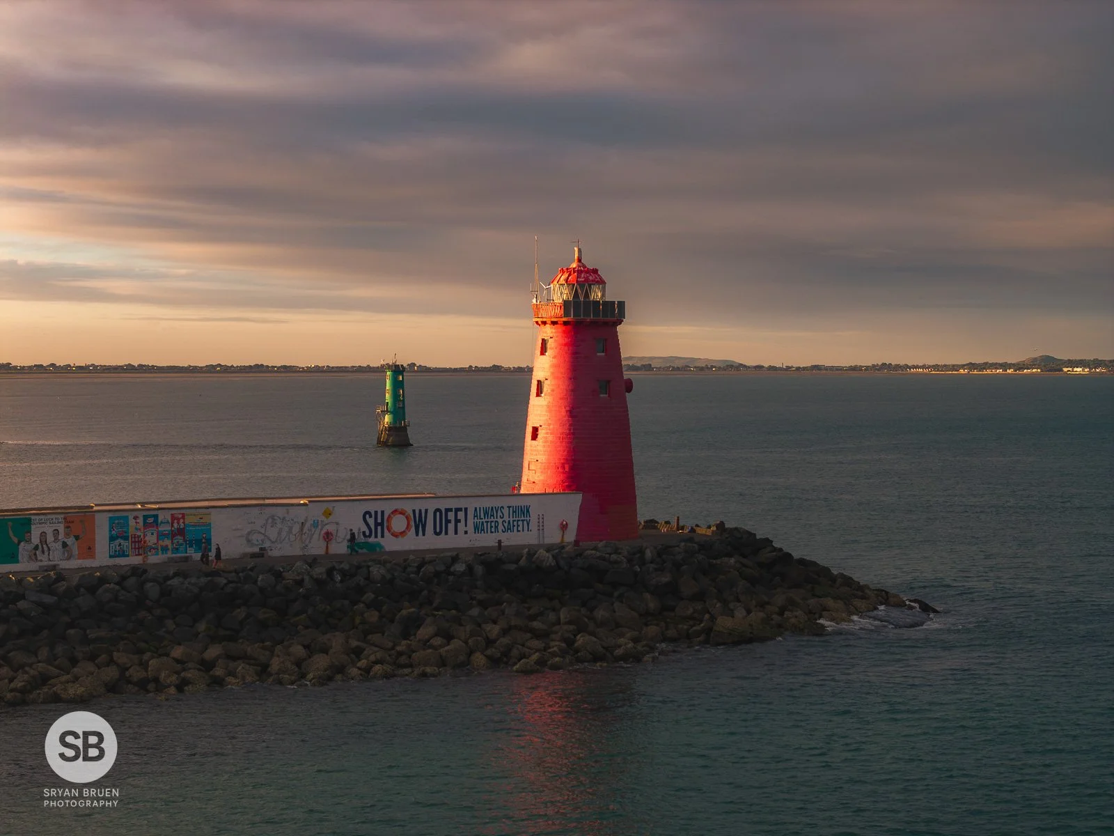 2025-06-28 Poolbeg Lighthouse and North Bull Lighthouse sunset side light 28 June 2025.jpg