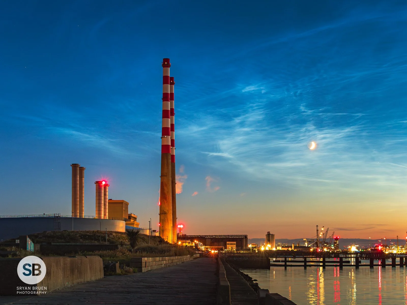 2025-06-29 Poolbeg Chimneys noctilucent clouds and crescent moon.jpg