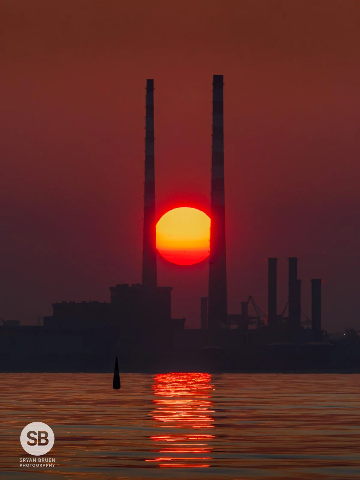 2026-07-16 Poolbeg Chimneys sunset alignment with Goat Boat Tours.jpg