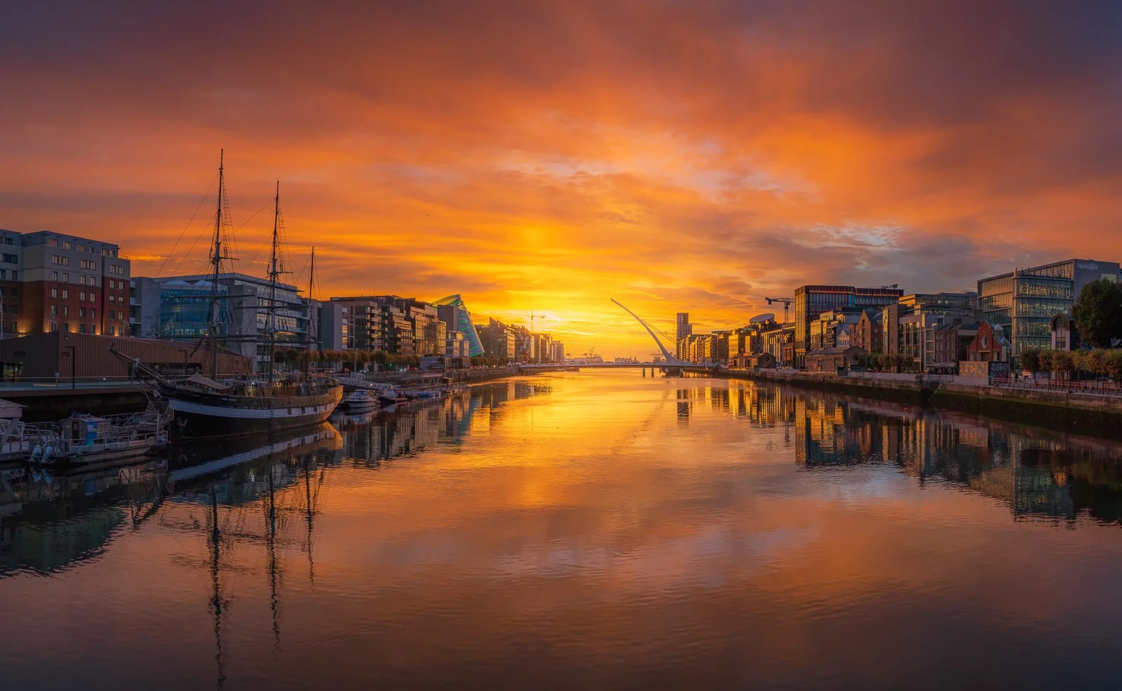 2026-09-24 Dublin Docklands sunrise sky reflections pano.jpg