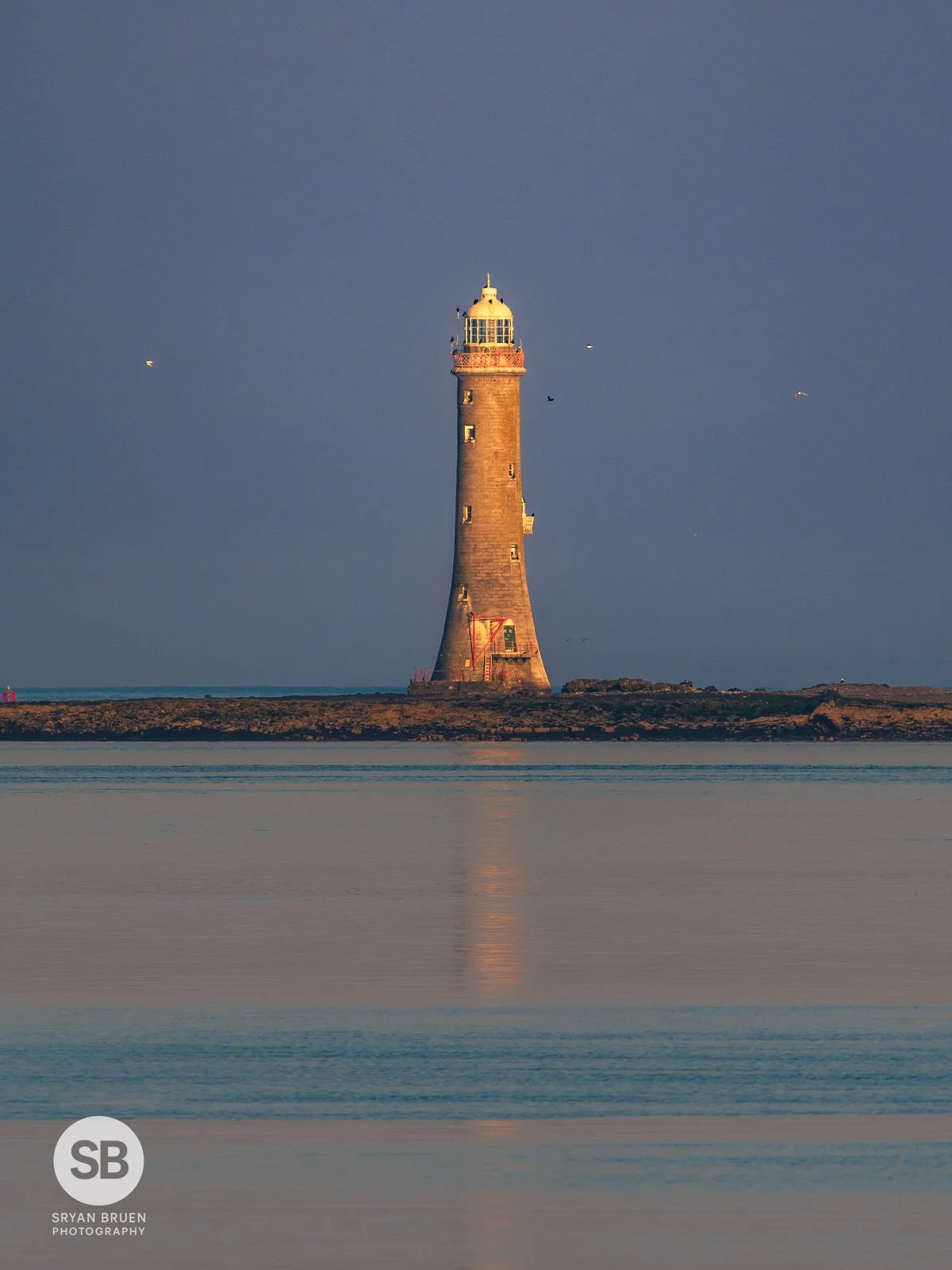 2025-04-10 Haulbowline Lighthouse sunset glow 10 April 2025.jpg