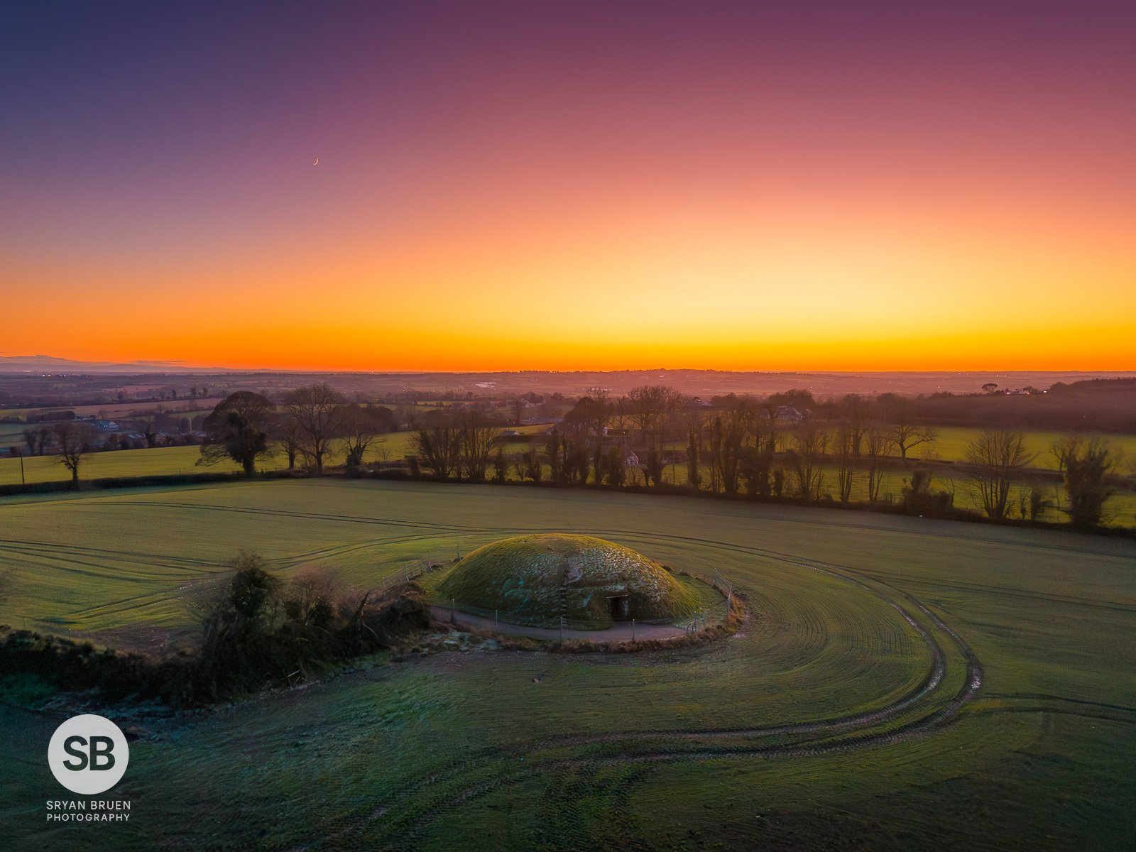 2025-01-02 Four Knocks Passage Tomb sunset glow 2 January 2025.jpg