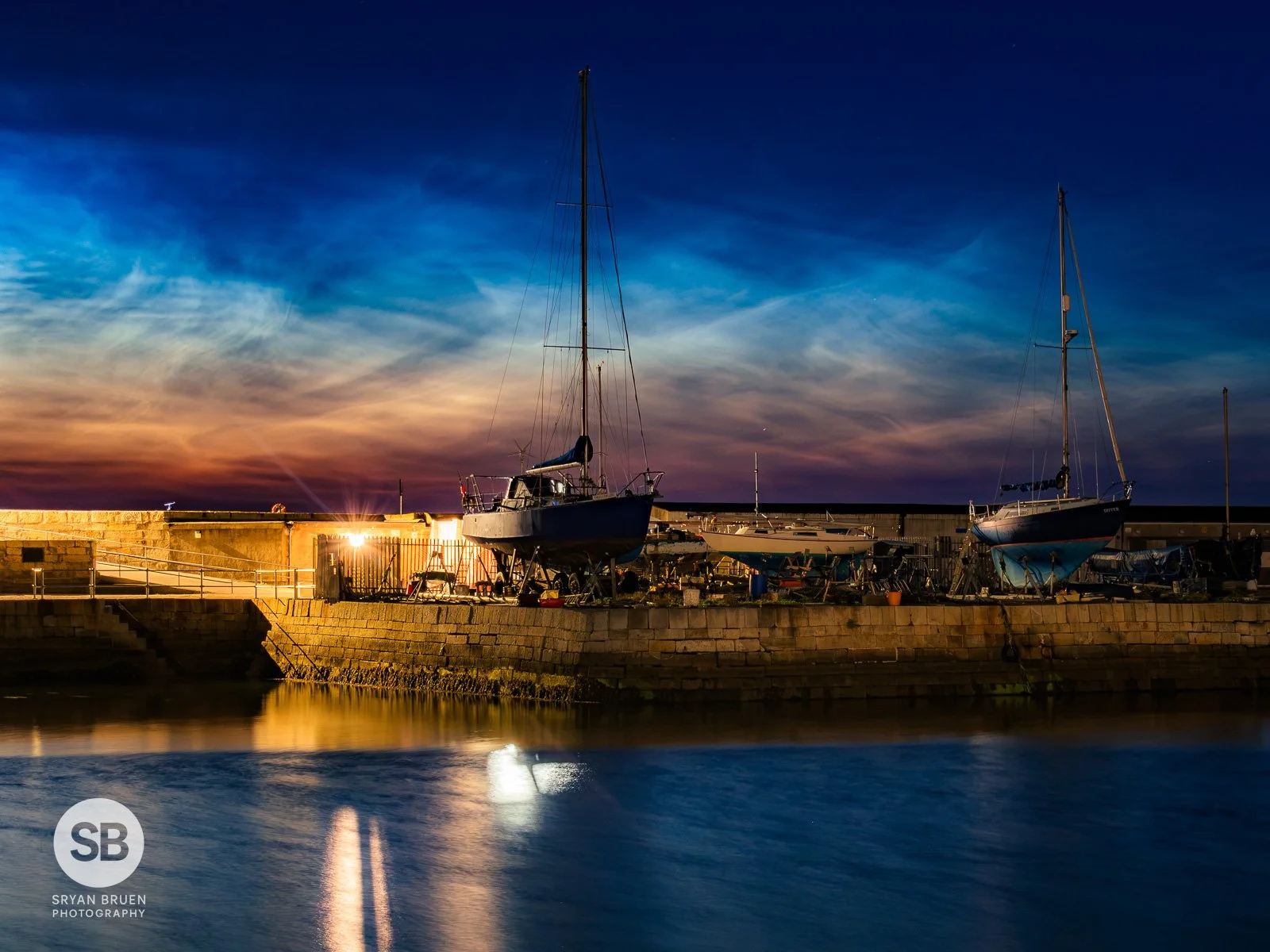 2026-07-08 Howth Harbour boats noctilucent clouds.jpg