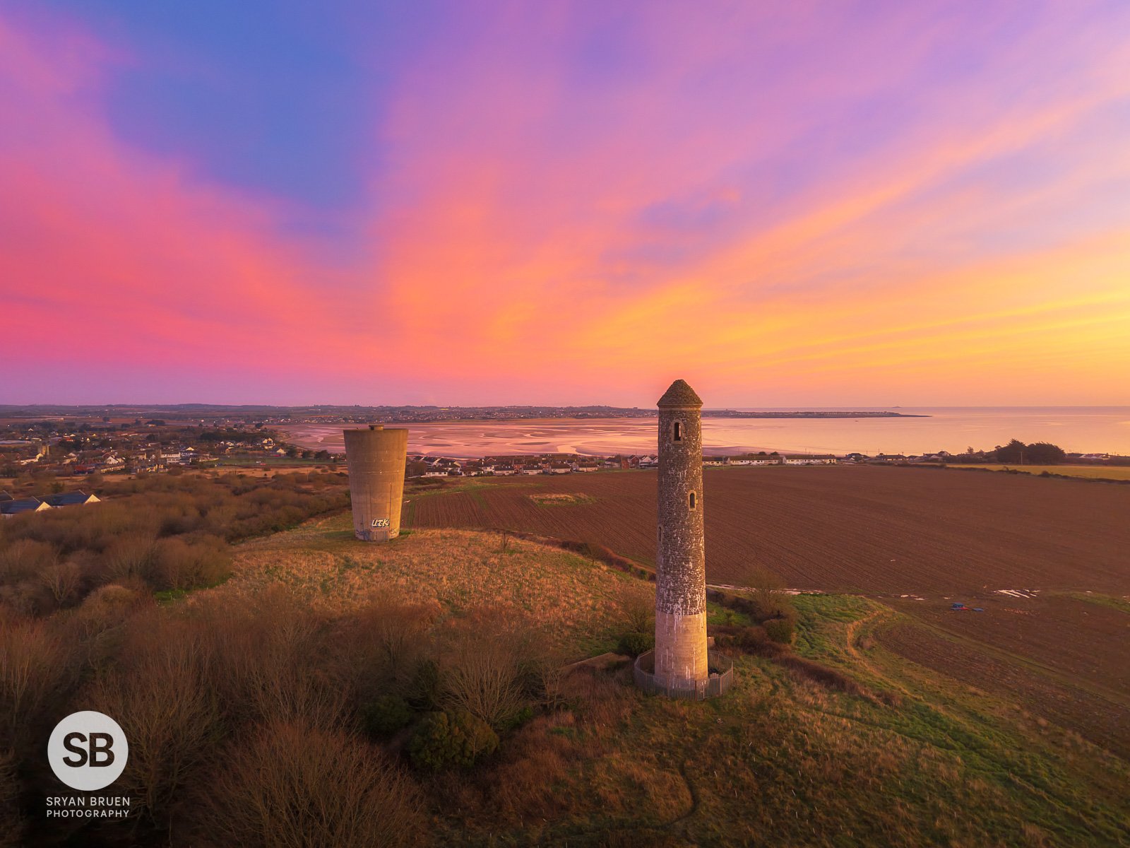 2025-03-04 Portrane round tower and water tower sunrise sky 4 March 2025.jpg