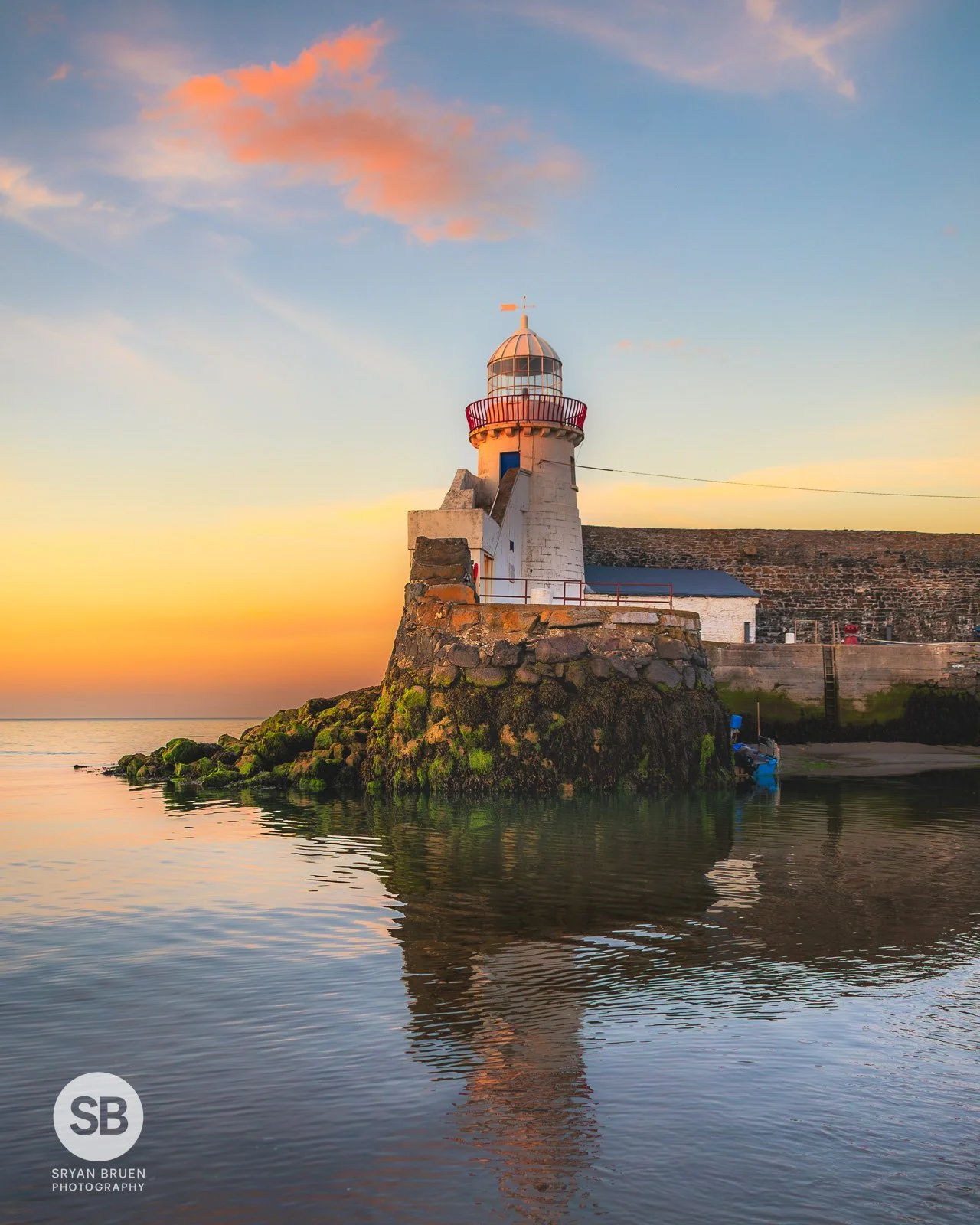 2024-07-27 Balbriggan Lighthouse sunset glow and reflection 27 July 2024.jpg