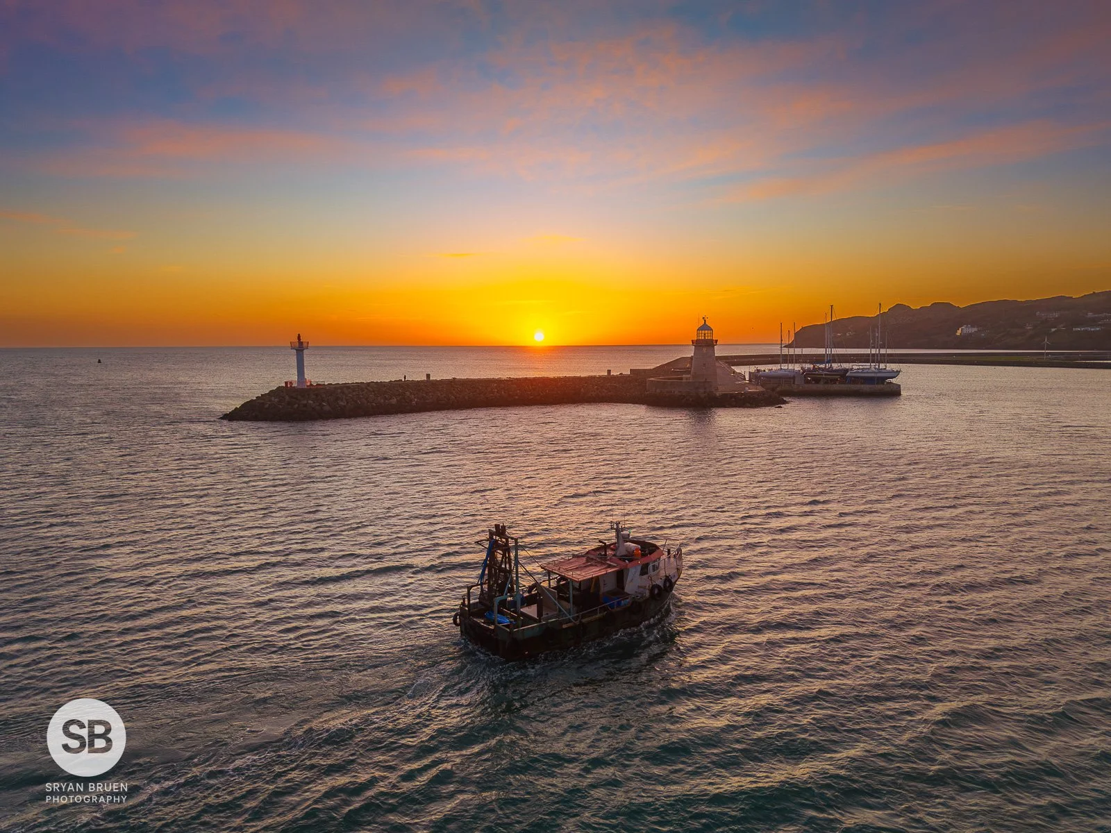 2025-02-25 Howth Lighthouse sunrise trawler 25 February 2025.jpg