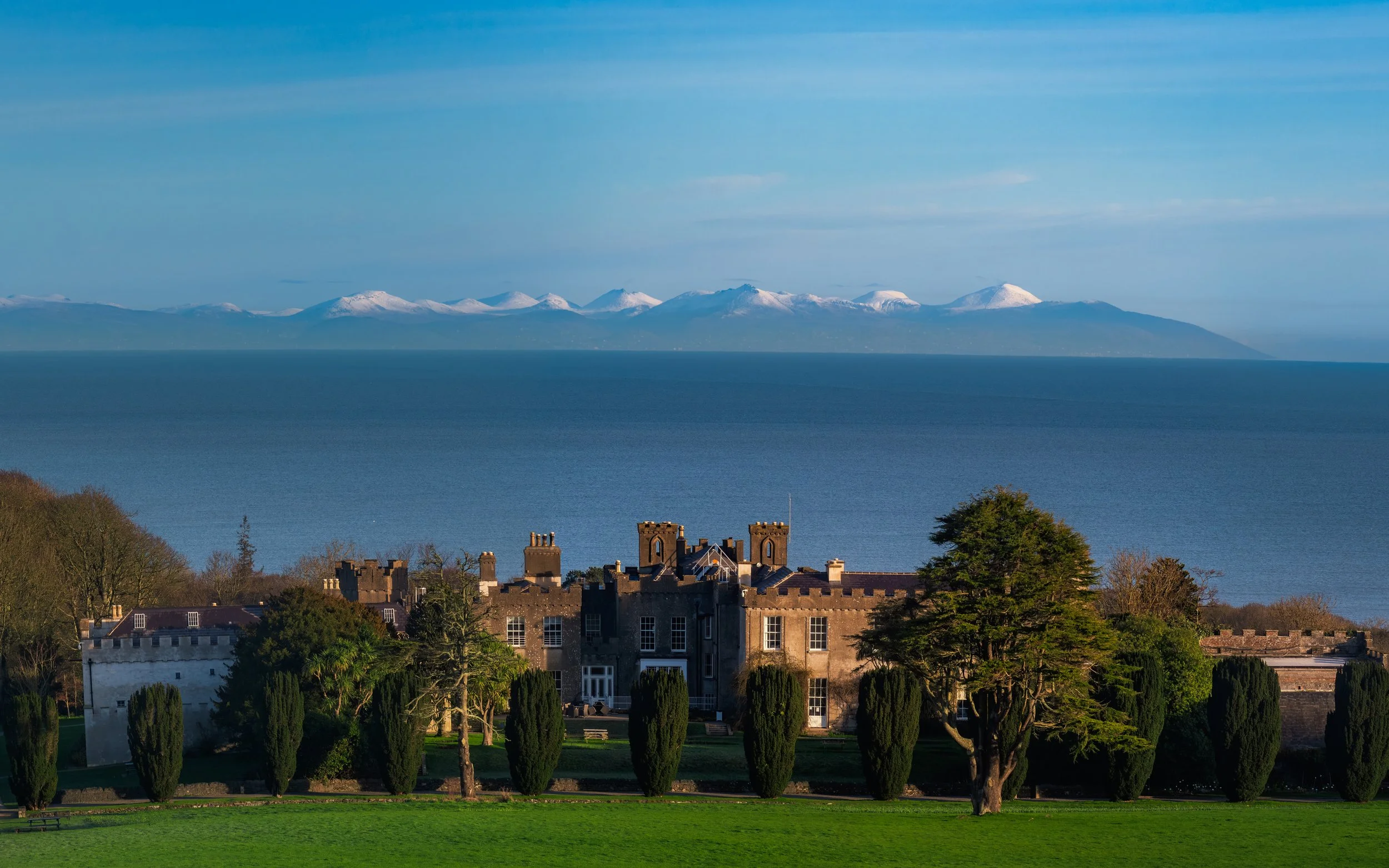 2026-02-14 Ardgillan Castle with snow capped Mourne Mountains.jpg