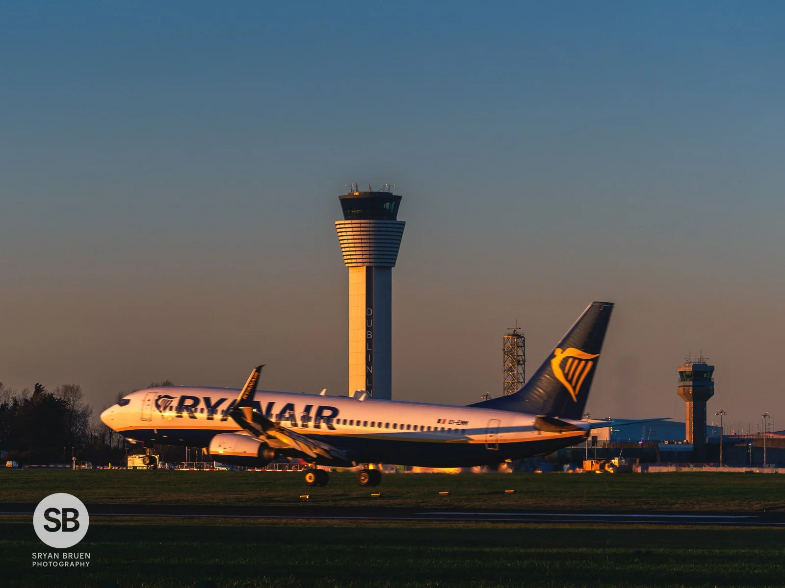 2025-12-16 Dublin Airport control towers Ryanair sunset glow.jpg