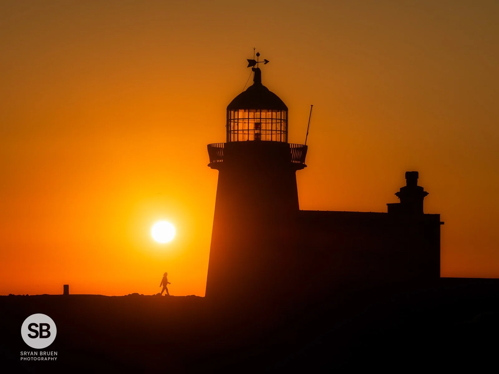 2025-07-12 Howth Lighthouse walker sunrise 12 July 2025.jpg