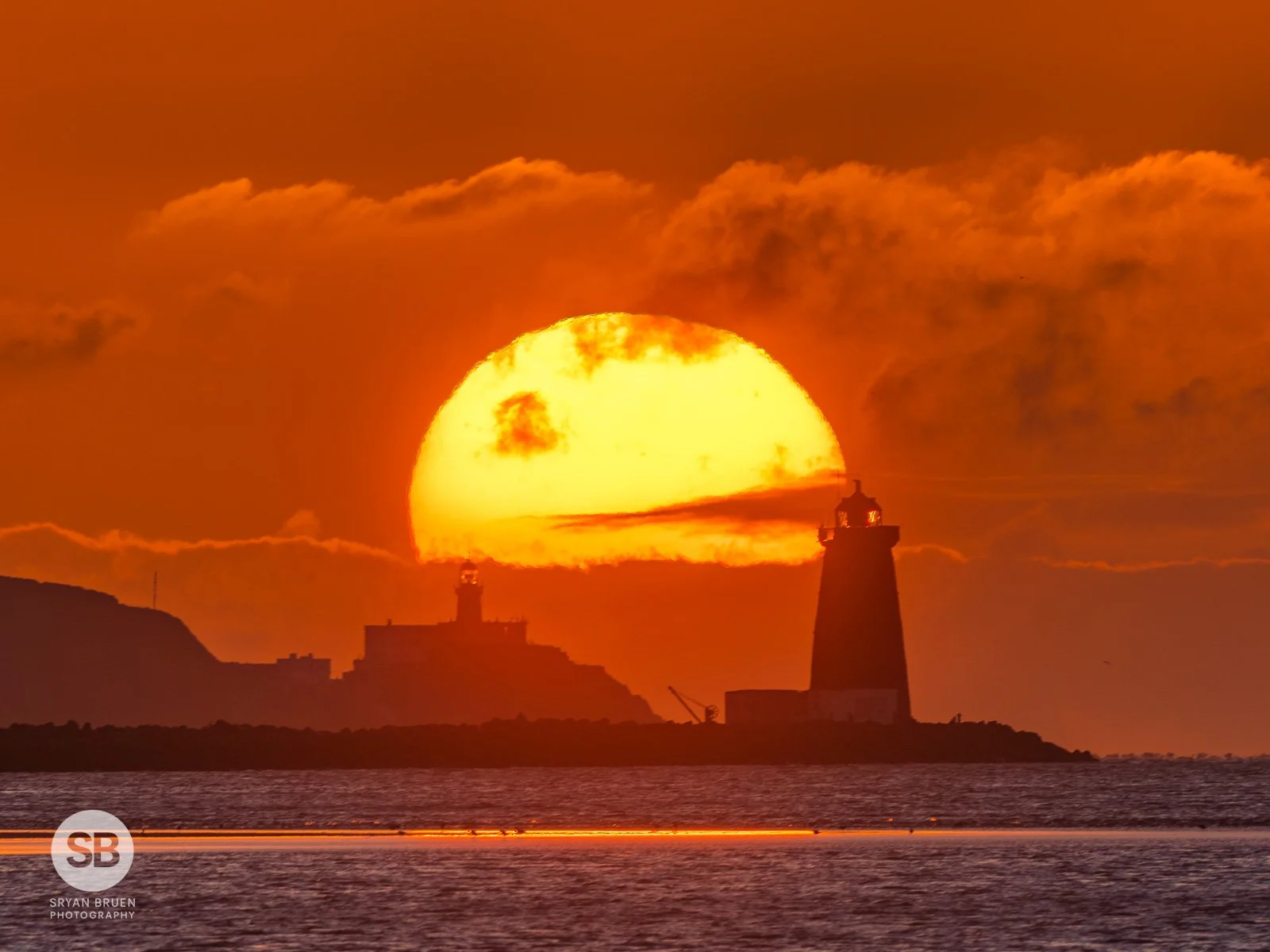 2024-04-16 Poolbeg and Baily Lighthouse sunrise 16 April 2024.jpg