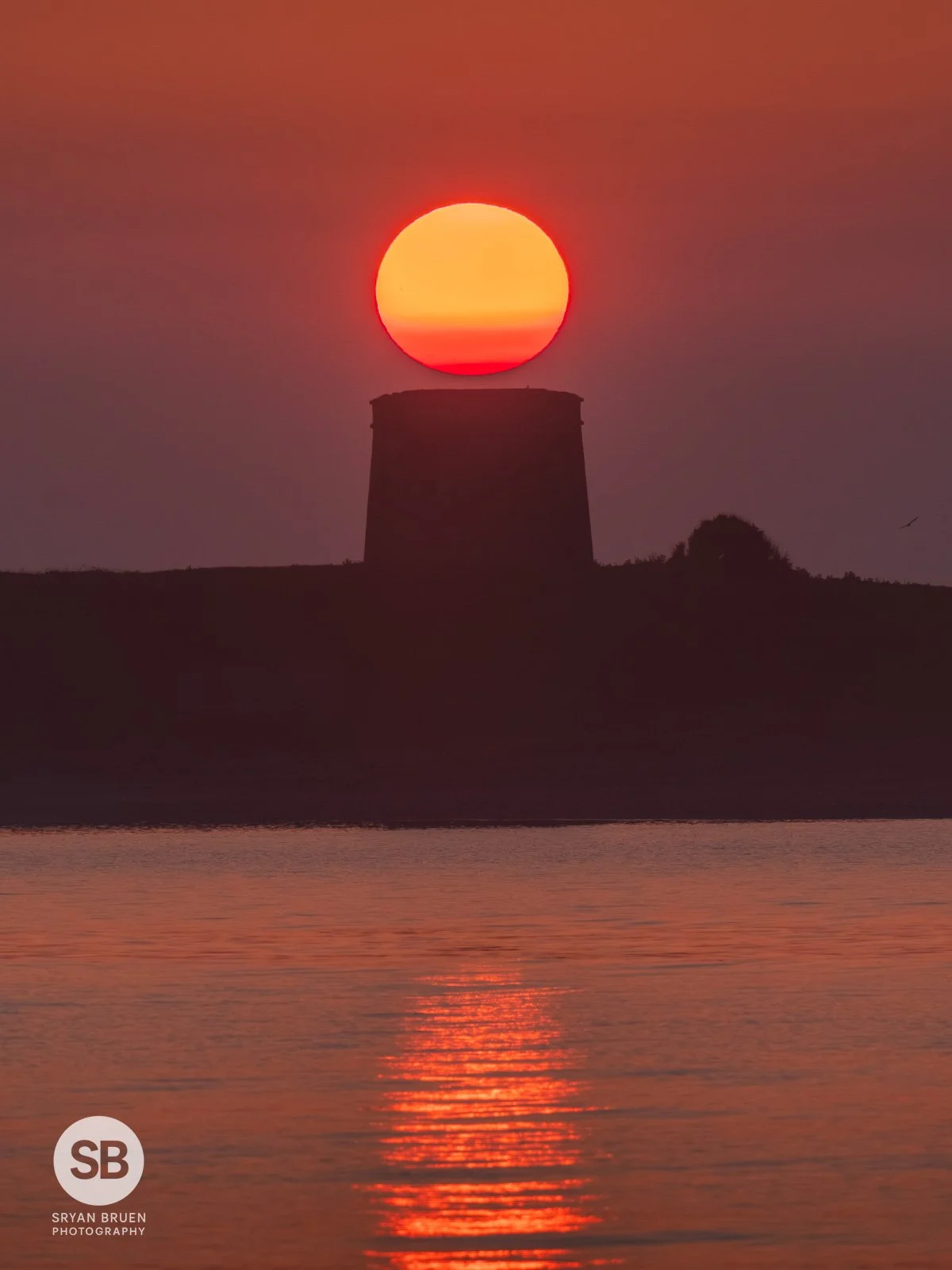 2024-04-27 Shenick Island martello tower sunrise reflection.jpg