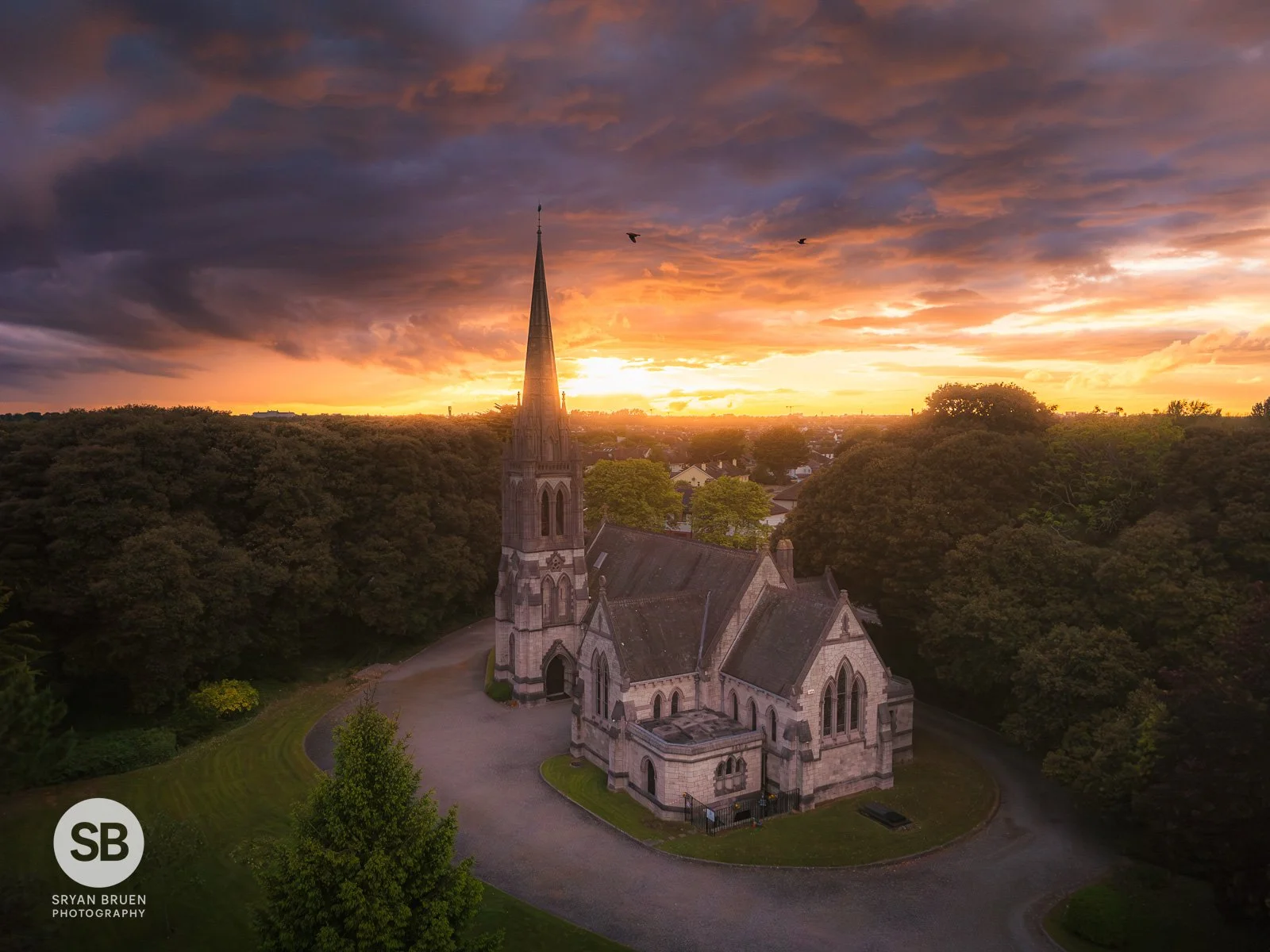 2026-05-16 All Saints Church of Ireland Raheny sunset sky with birds.jpg
