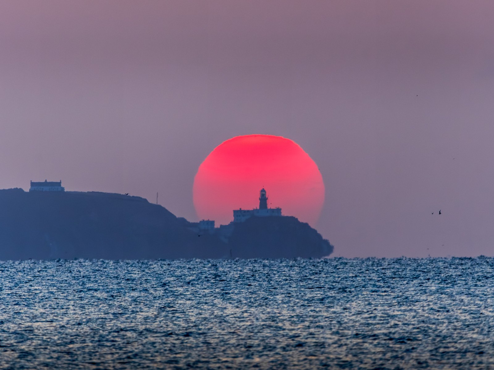 2026-07-18 Baily Lighthouse red sunrise from Blackrock.jpg