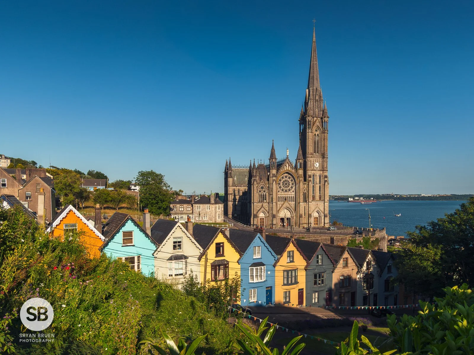 2026-07-08 Cobh Deck of Cards Houses blue sky view.jpg