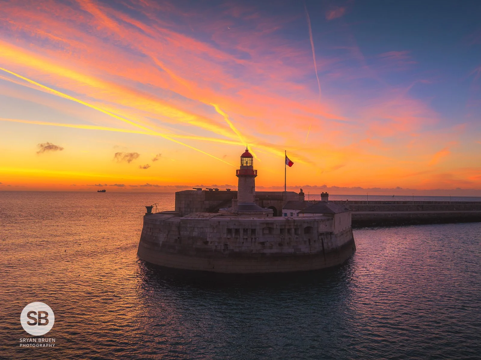 2026-08-10 Dun Laoghaire Lighthouse sunrise contrails.jpg