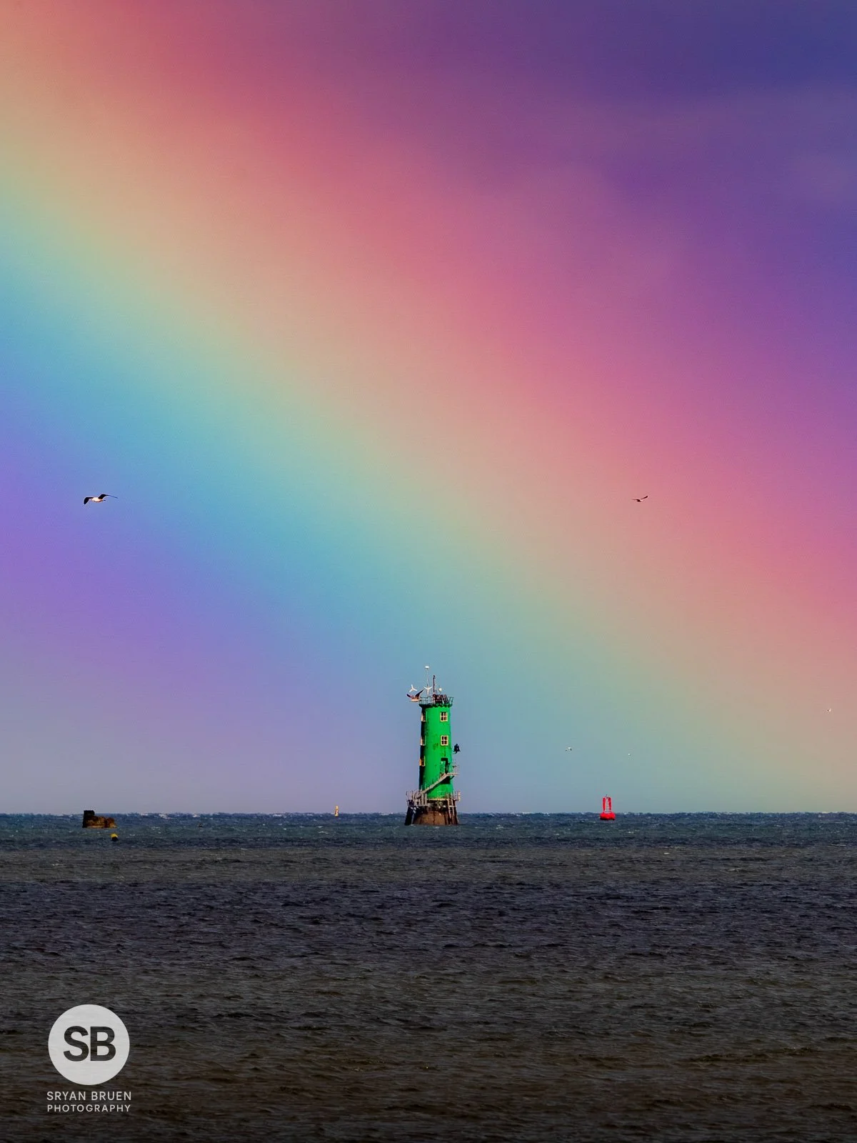 2026-06-04 North Bull Lighthouse rainbow from Clontarf.jpg