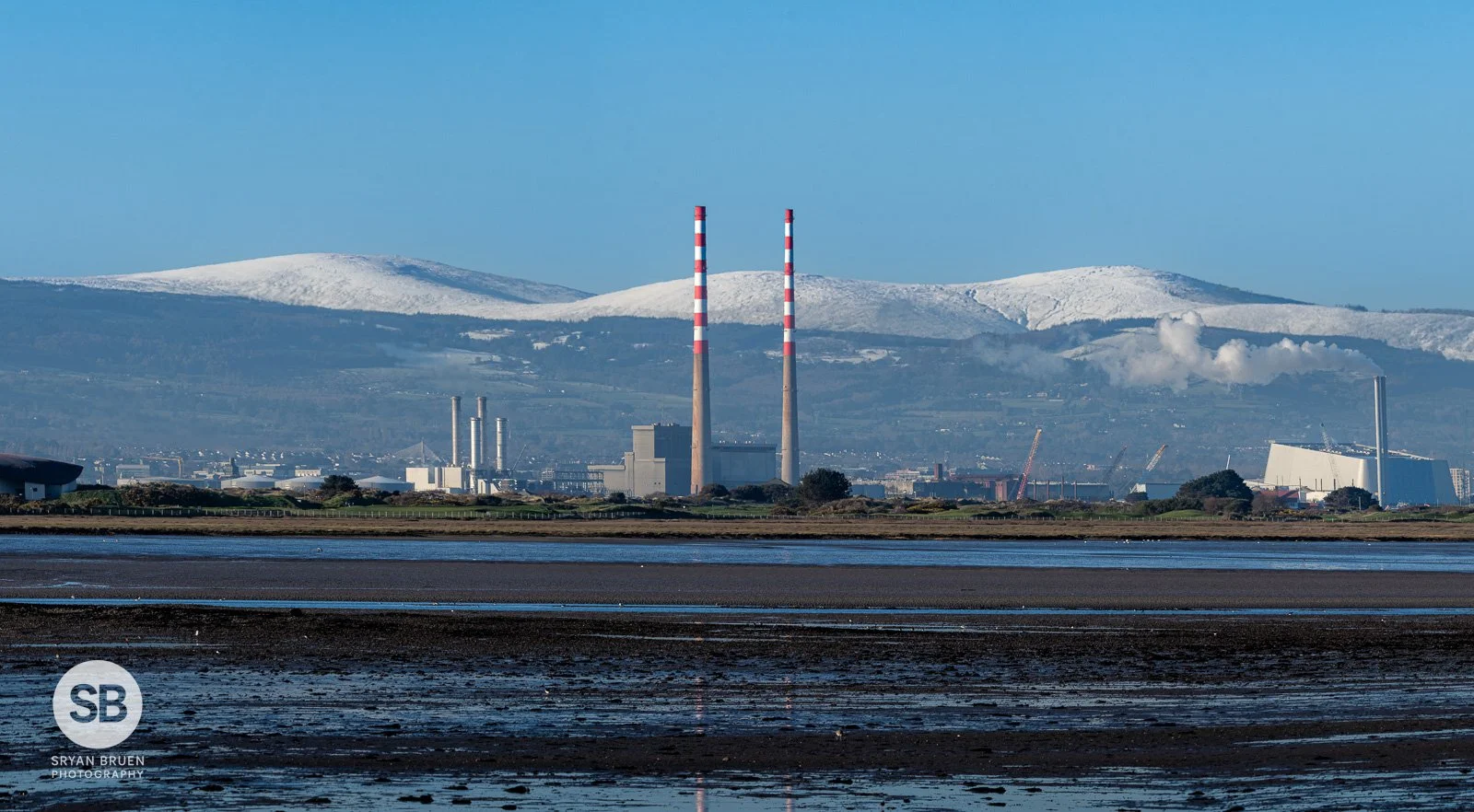 2026-03-06 Poolbeg Wicklow Mountains snow pano from Bayside.jpg