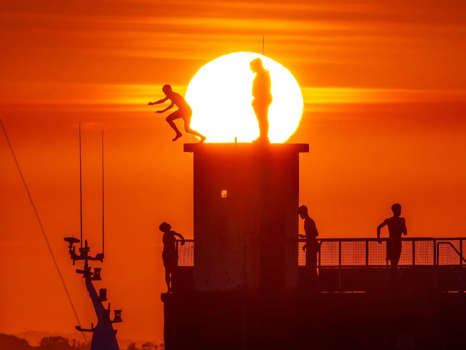 2026-07-13 Skerries pier jumpers sunset.jpg