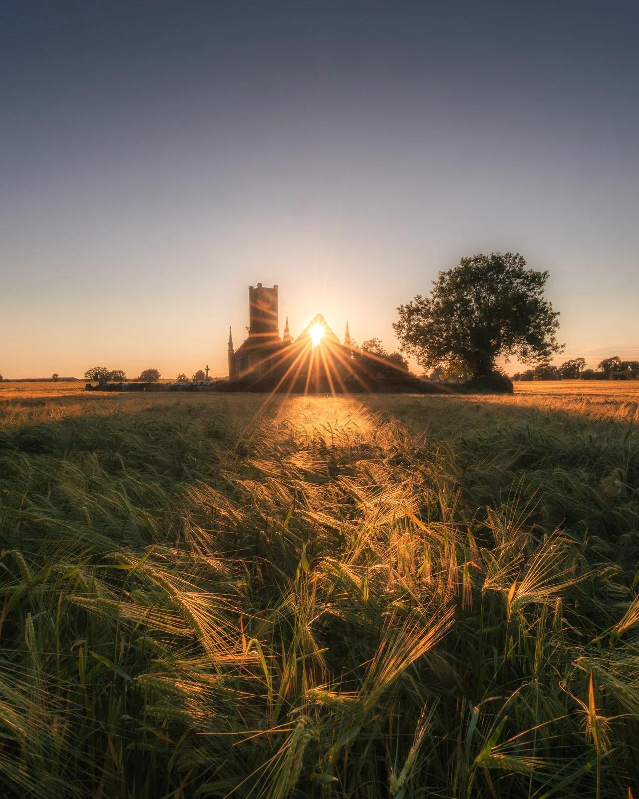 2026-06-23 Ballynafagh Church sunset sunstar in the church.jpg
