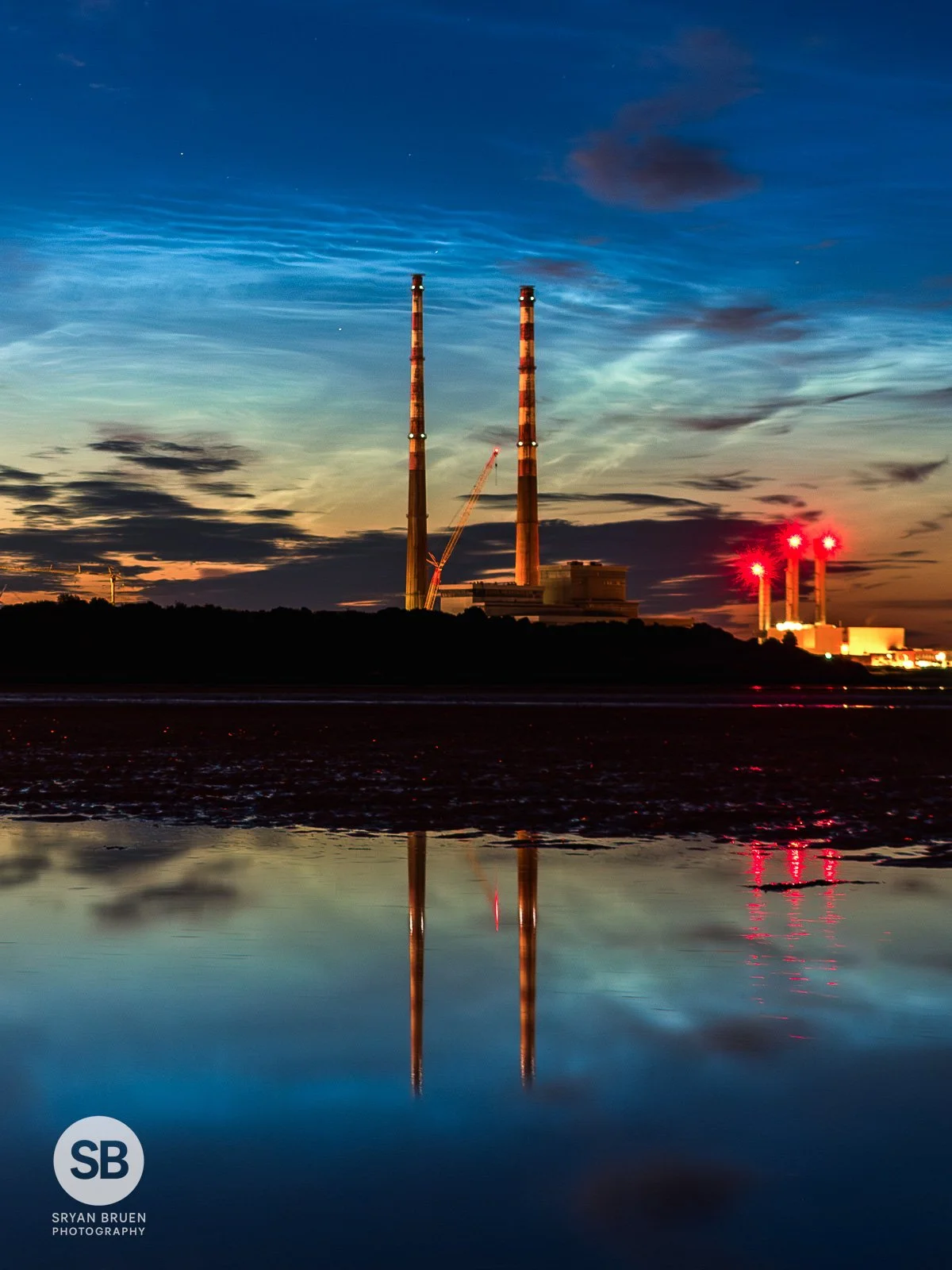 2024-06-20 Poolbeg Chimneys noctilucent clouds portrait 20 June 2024.jpg