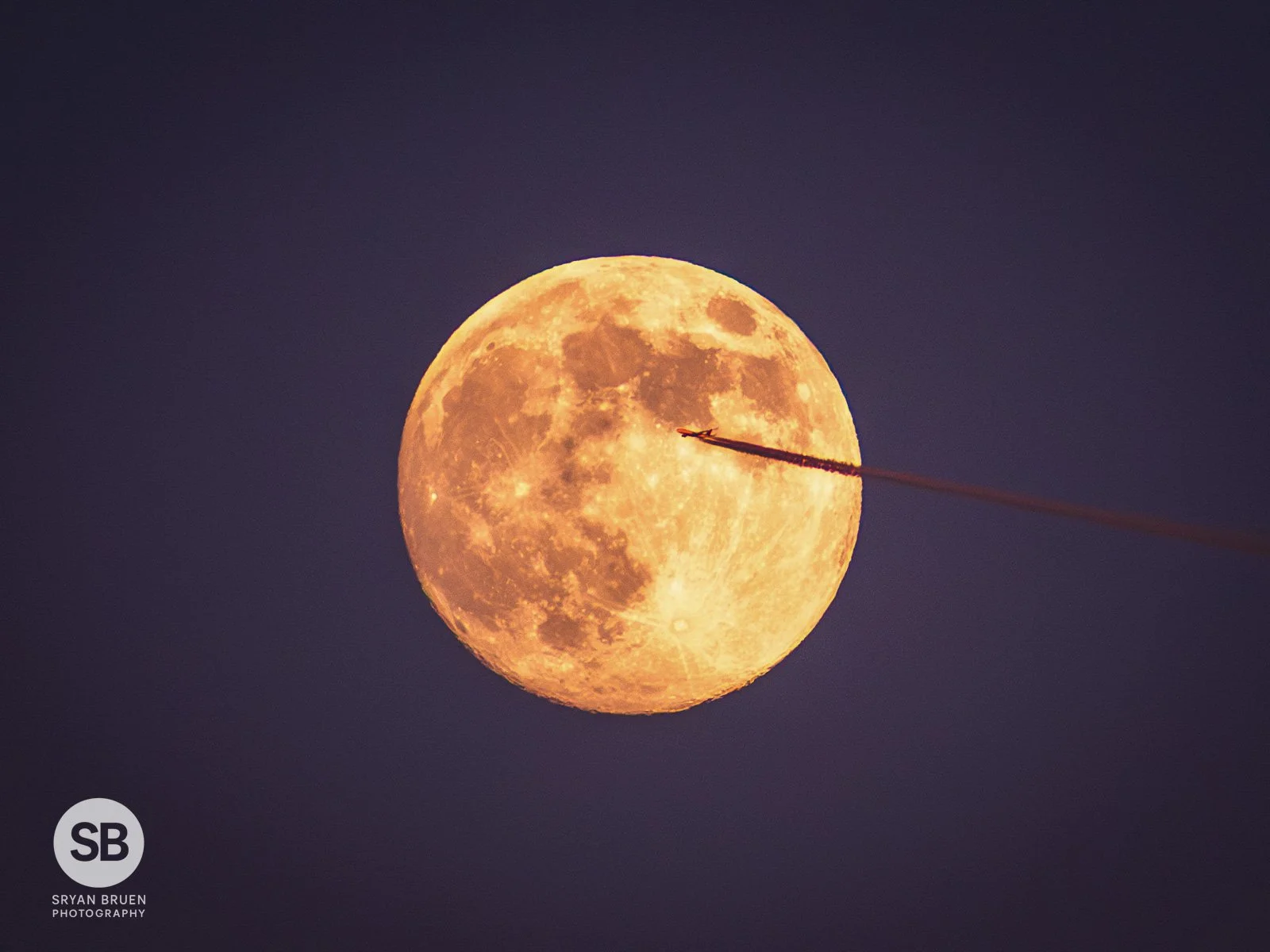 2026-01-02 Plane crossing moon with contrail.jpg