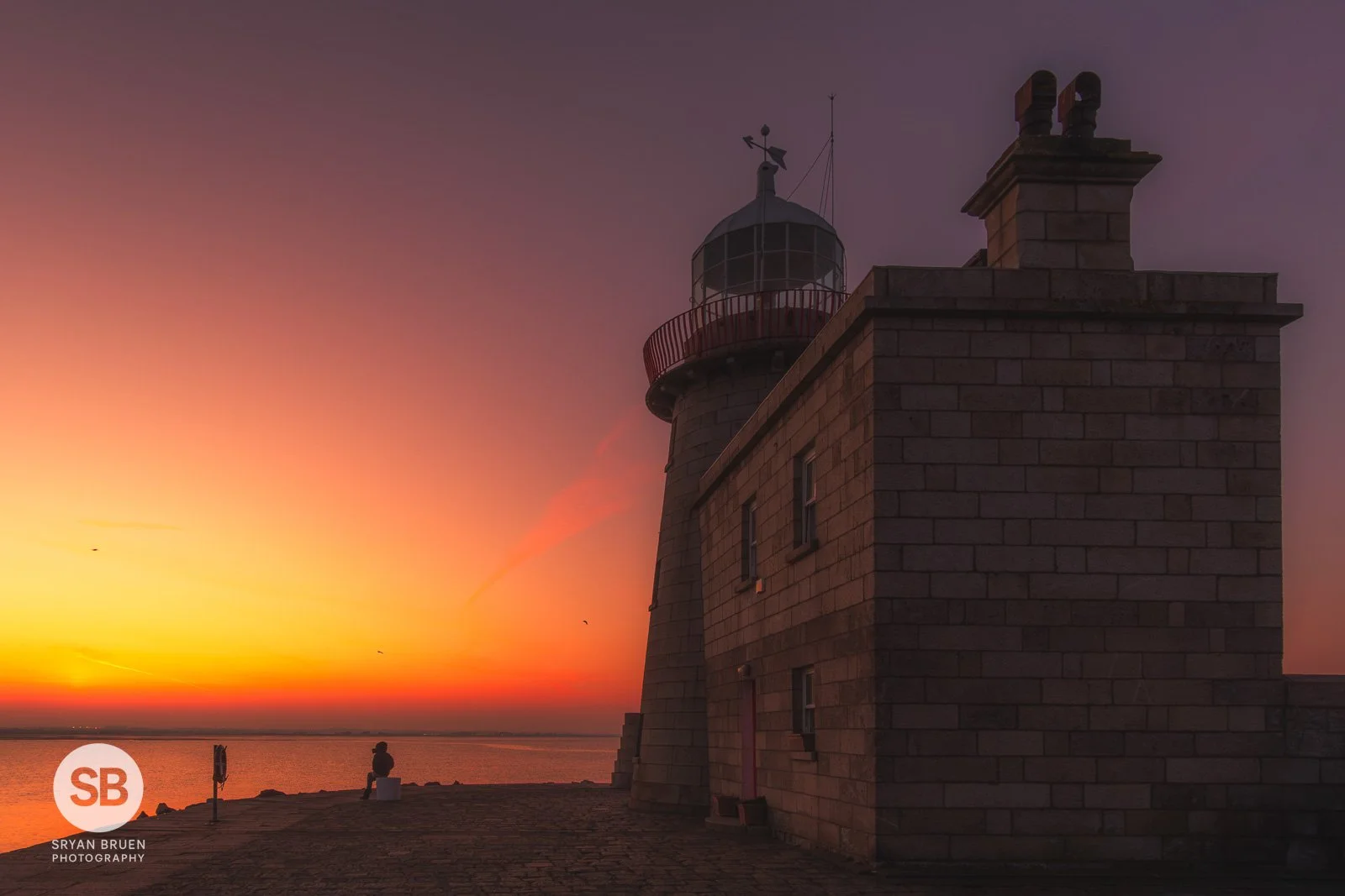 2025-03-19 Howth Lighthouse sunset afterglow watcher 19 March 2025.jpg