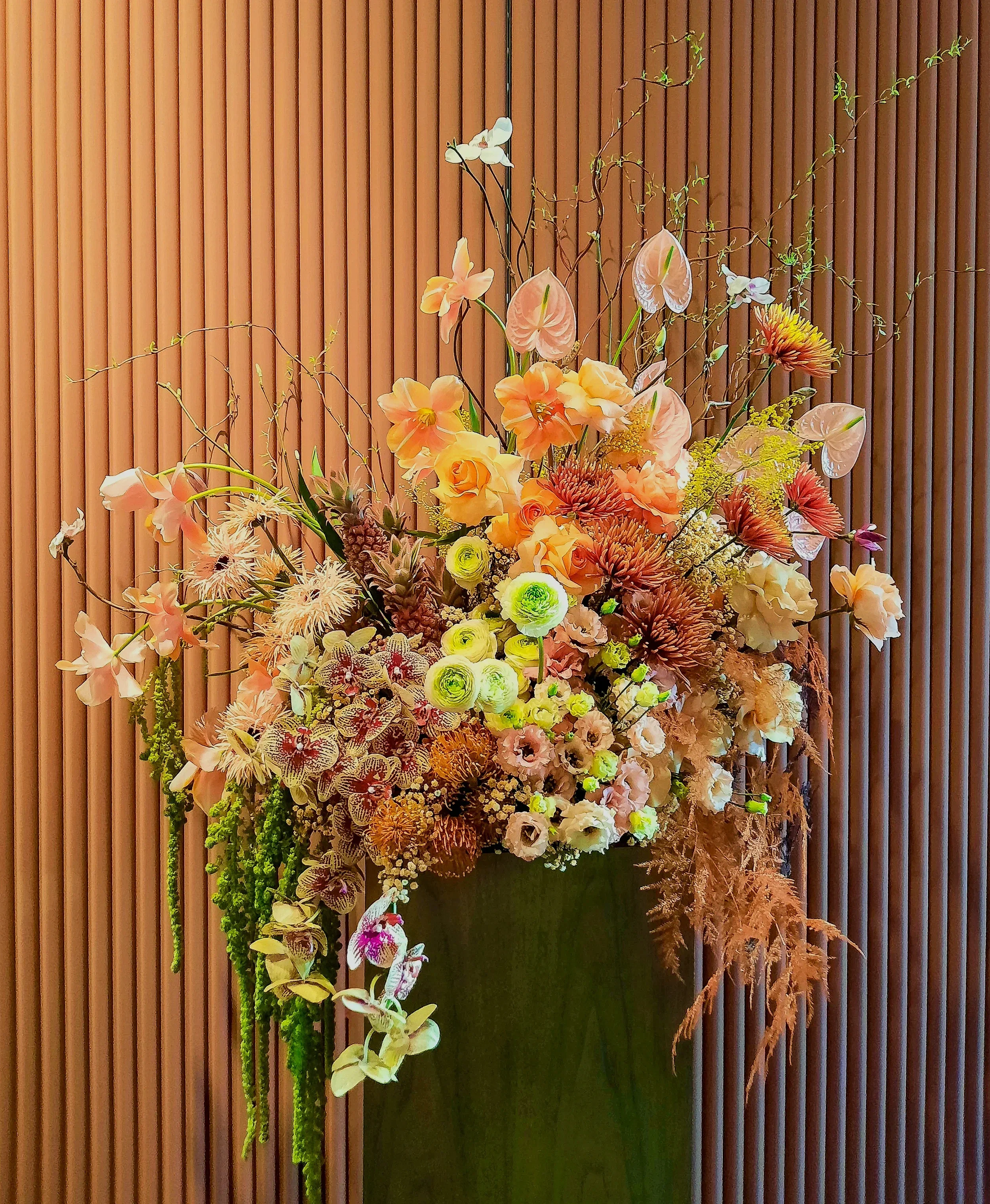 Floral installation with orchids and anthurium against wooden wall, Hotel Intercontinental Berlin 2024