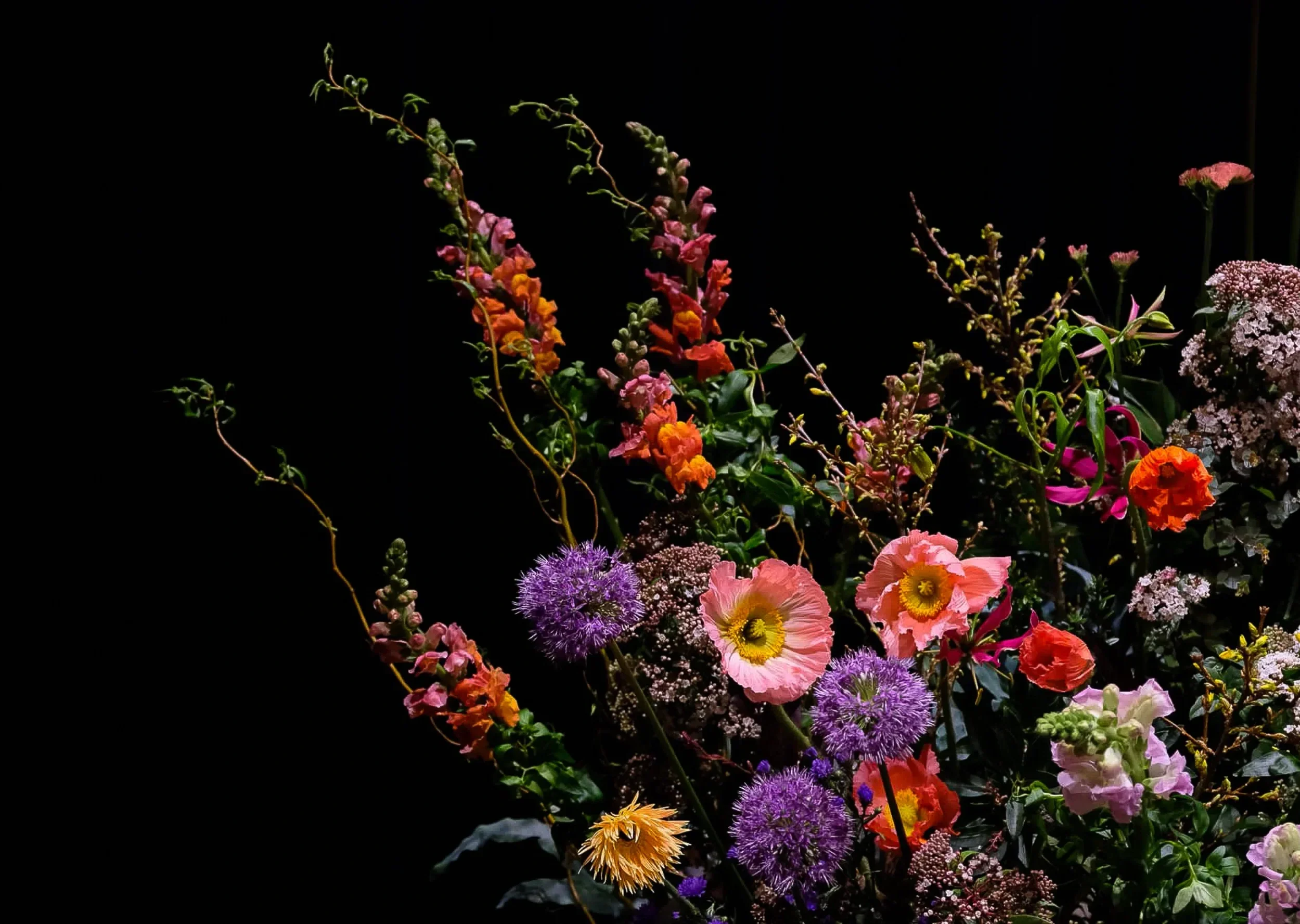 Floral landscape detail with gloriosa, poppies and eremurus, McQueens Flower School London 2025