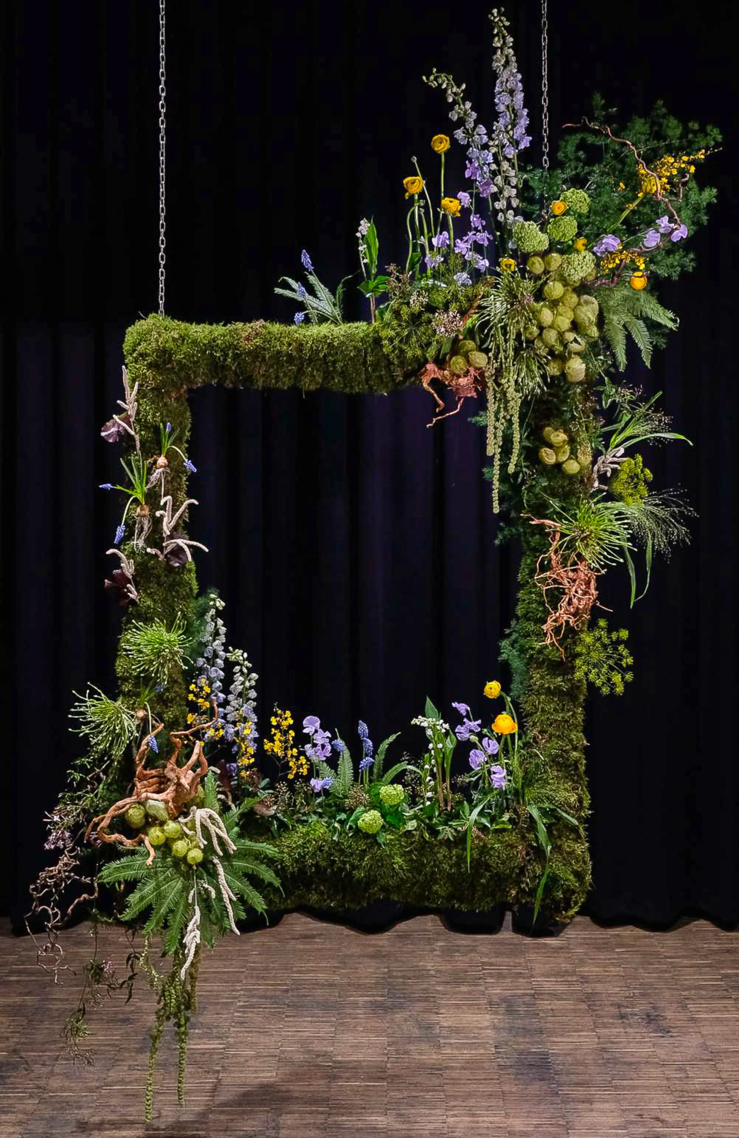 Suspended flower frame installation with marigold and delphinium, McQueens Flower School London 2025
