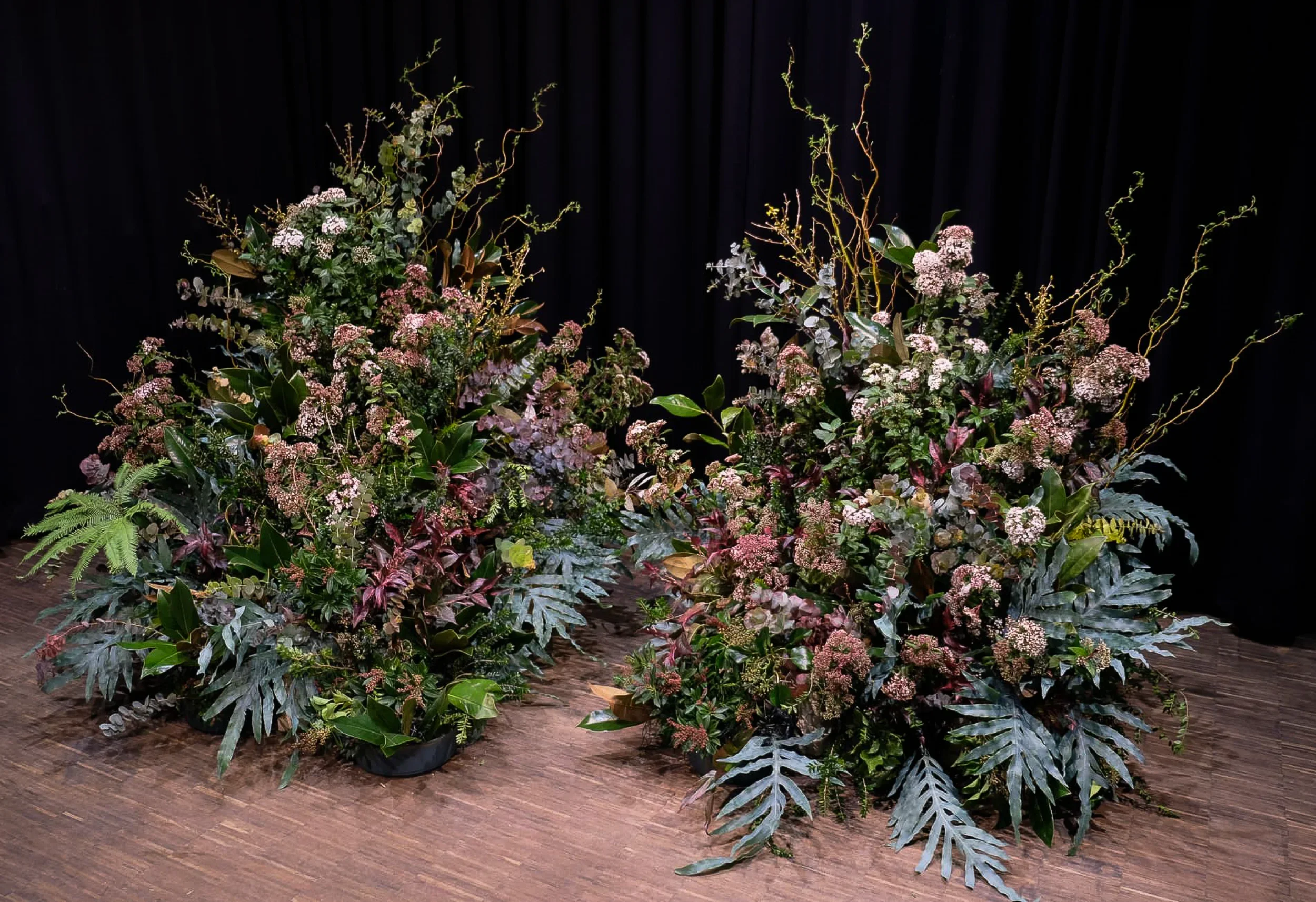 Flower landscape installation with chrysanthemum and fritillari on stage, McQueens London 2025