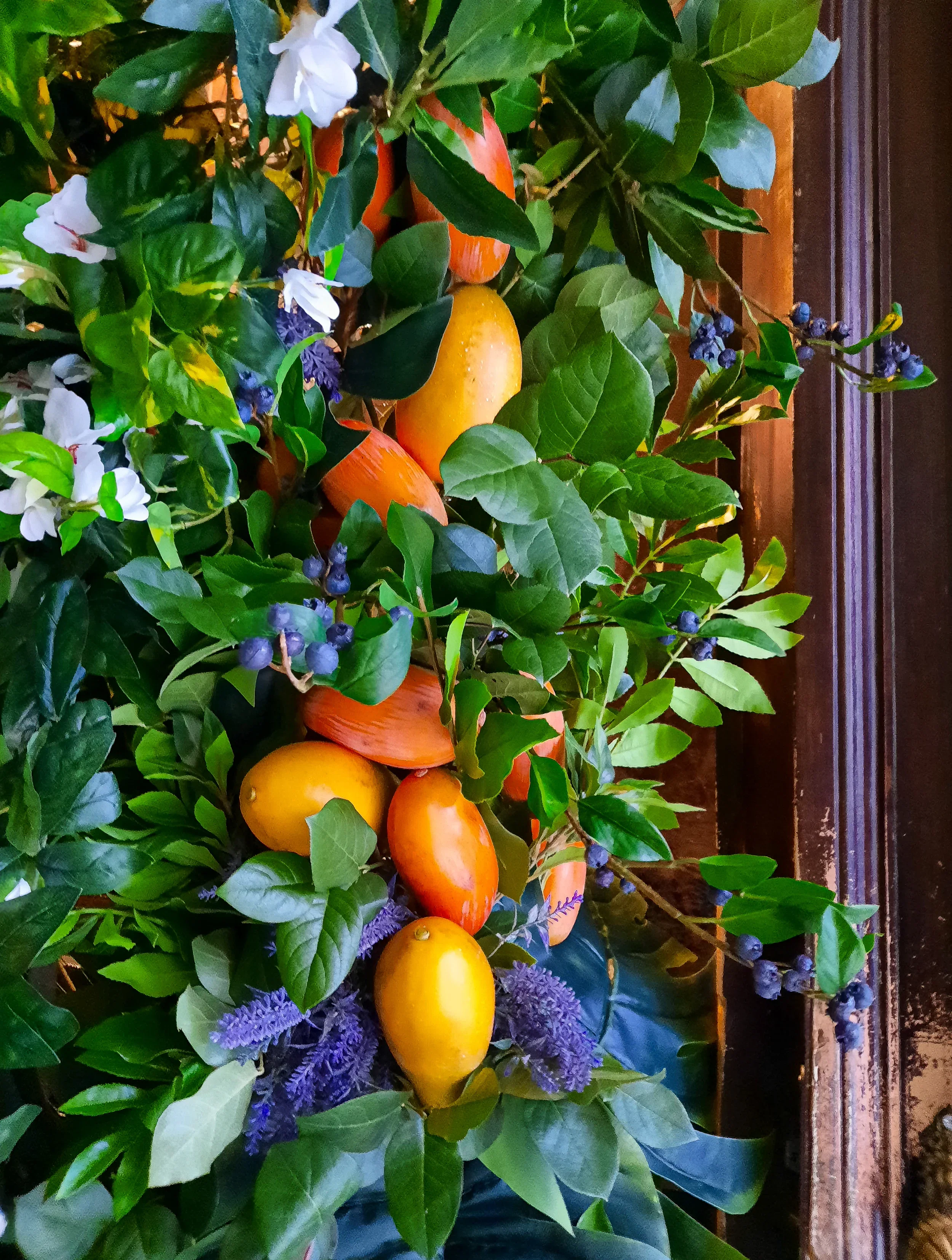 Close-up of floral arch with mango, blueberry and hibiscus, Fuze Tea event Berlin 2024