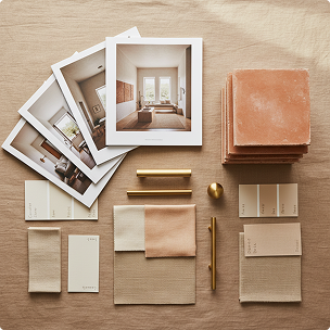 Sample interior design mood board with photos, fabric swatches, and design tools on a beige surface.