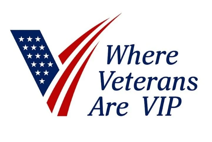 Logo with a stylized American flag and the text "Where Veterans Are VIP" in blue.