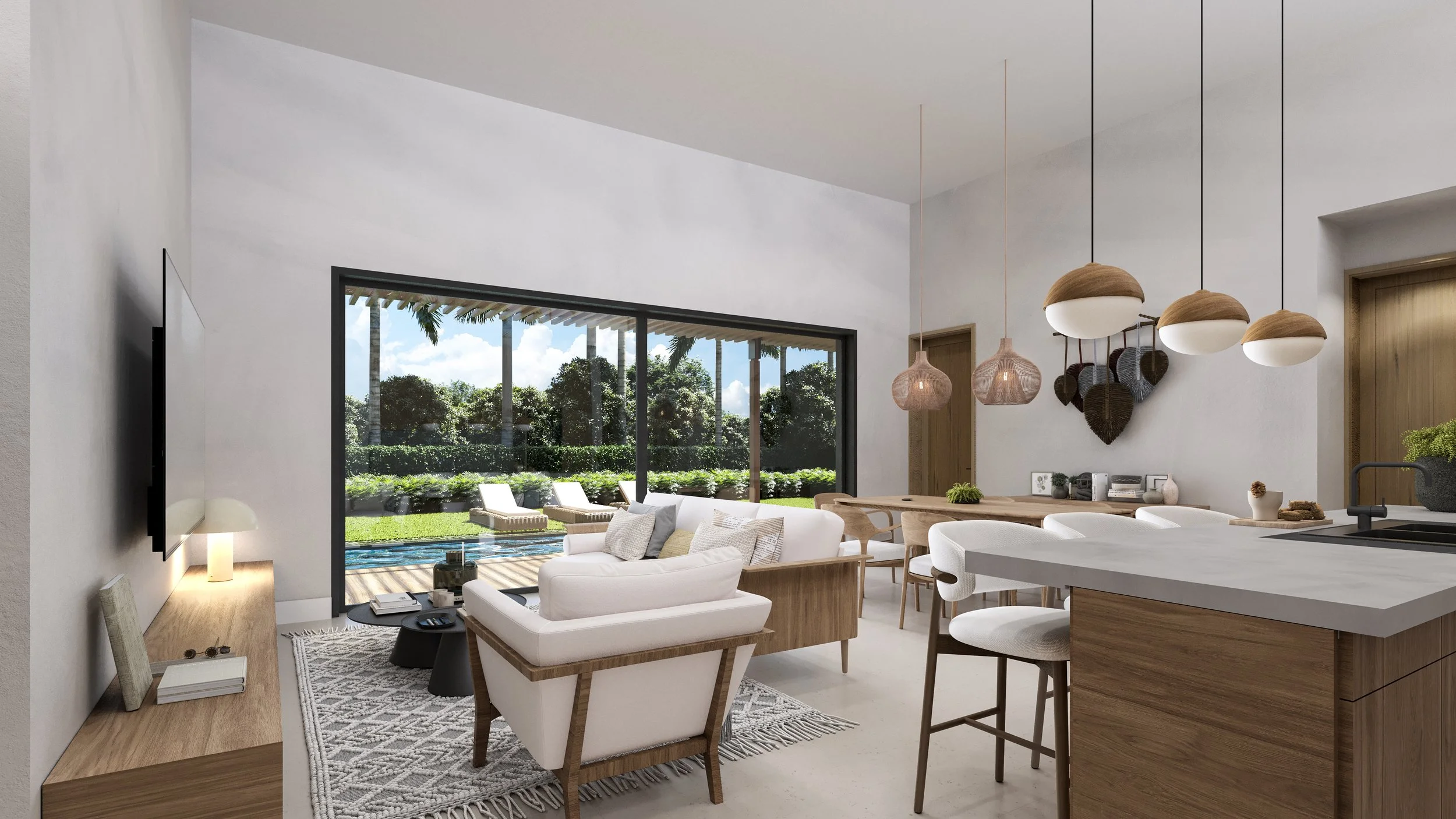Modern living room and kitchen with large sliding glass door opening to outdoor pool and garden, with white sofa, wooden furniture, pendant lights, and decorative wall hangings.