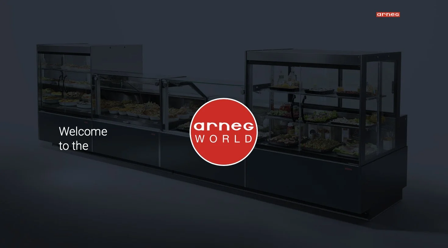 Lämpökylpytiloja sisältävä näyteikkuna, jossa lukee 'Welcome to the arneg WORLD' ja Arneg-logon sisältävä punainen ympyrä.