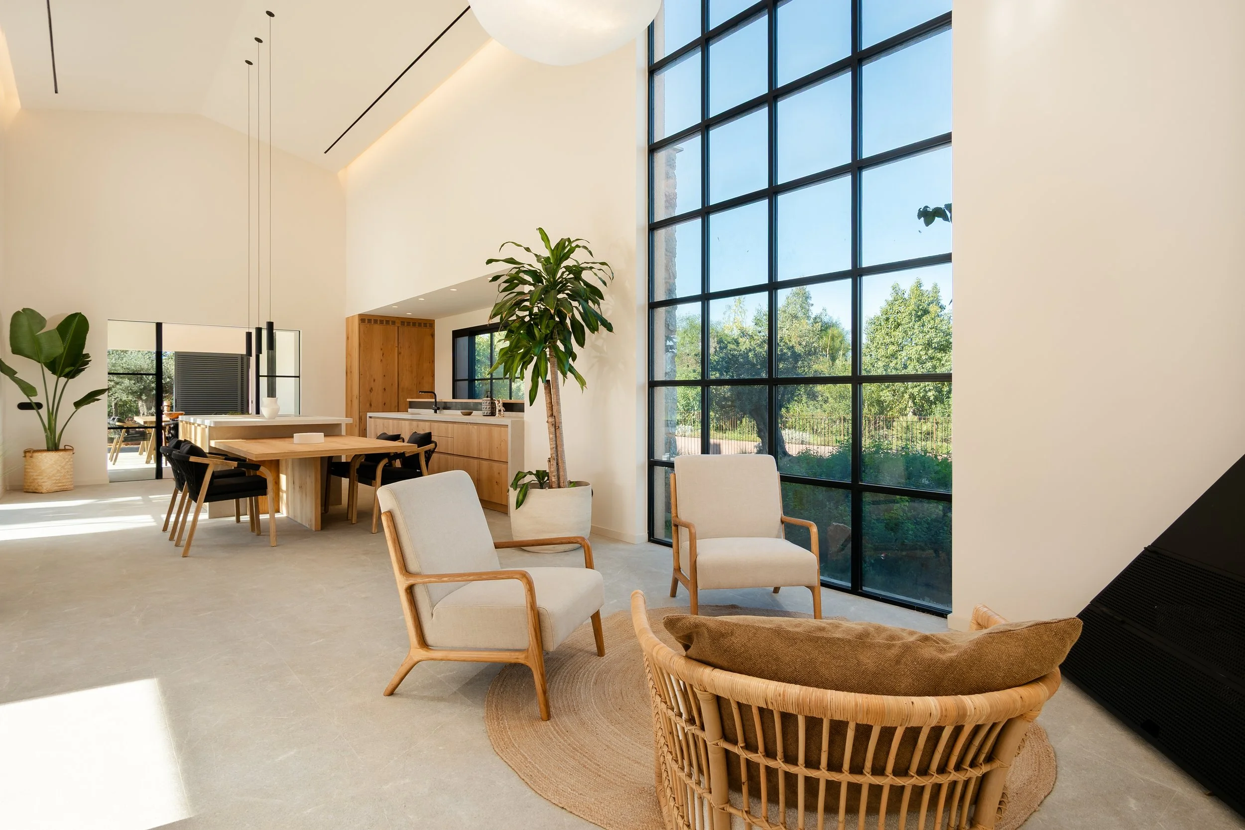 Double-height living room with Crittall windows and oak furniture, Sebastià Muntaner villa, Mallorca