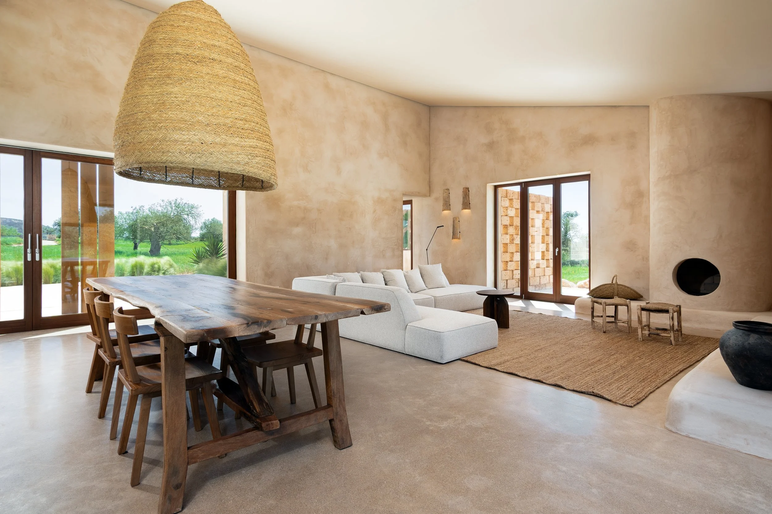 Open-plan living space with polished concrete floors and iroko joinery, Cas Concos finca Mallorca