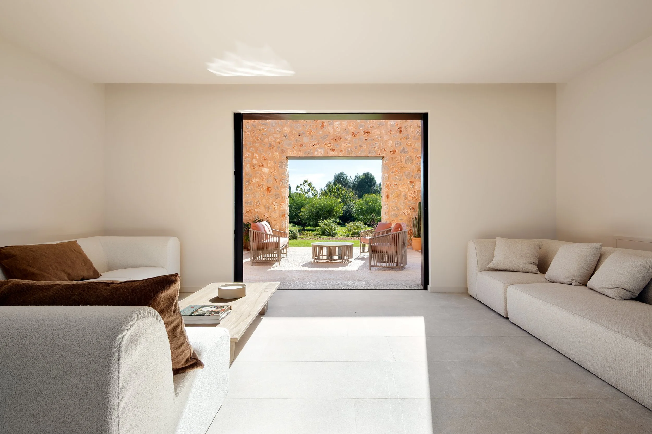 Sun-filled entrance hall with solid oak door and Crittall glass, Mallorca residential architecture