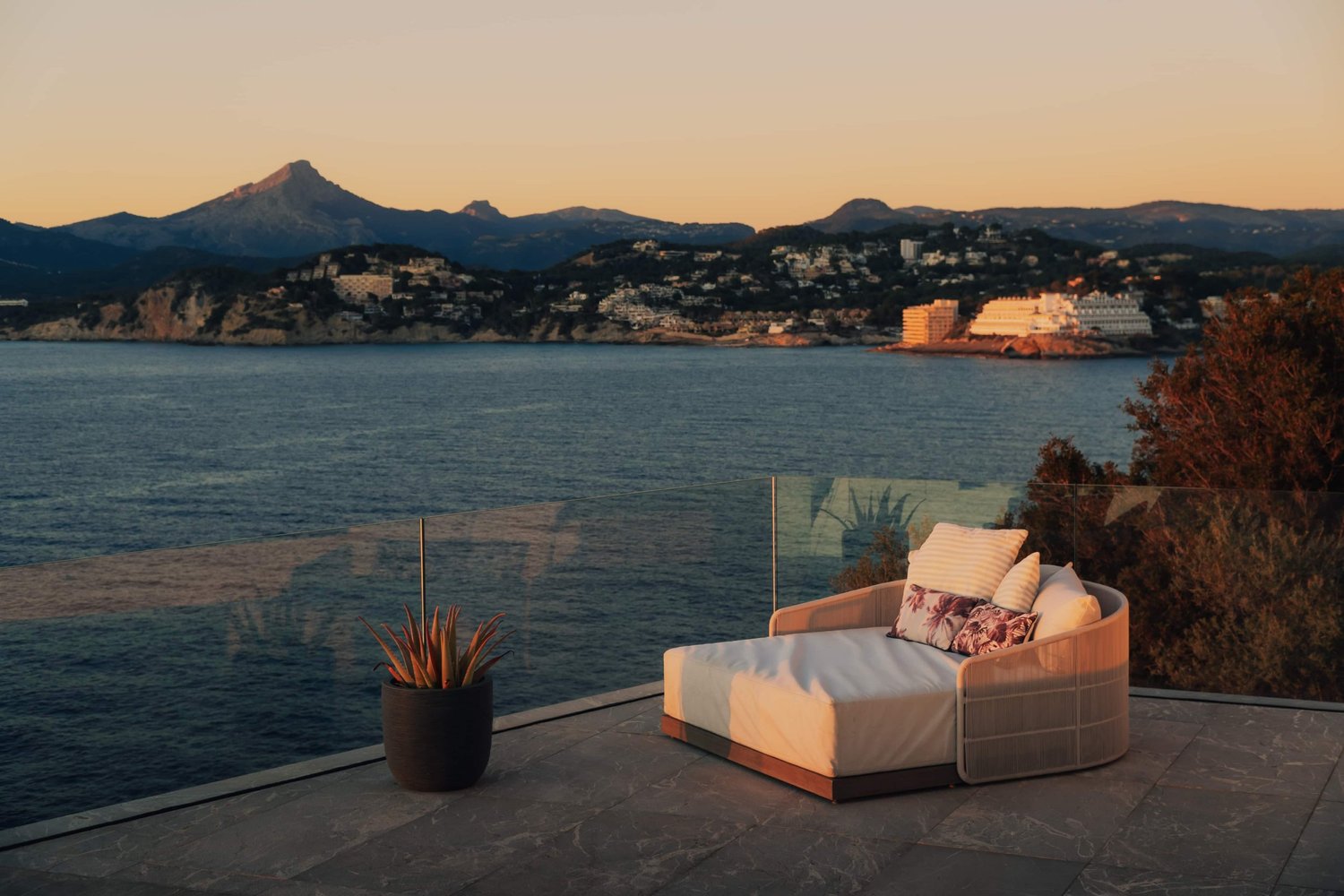 Contemporary cliffside villa photographed at dusk above the Mediterranean in Mallorca