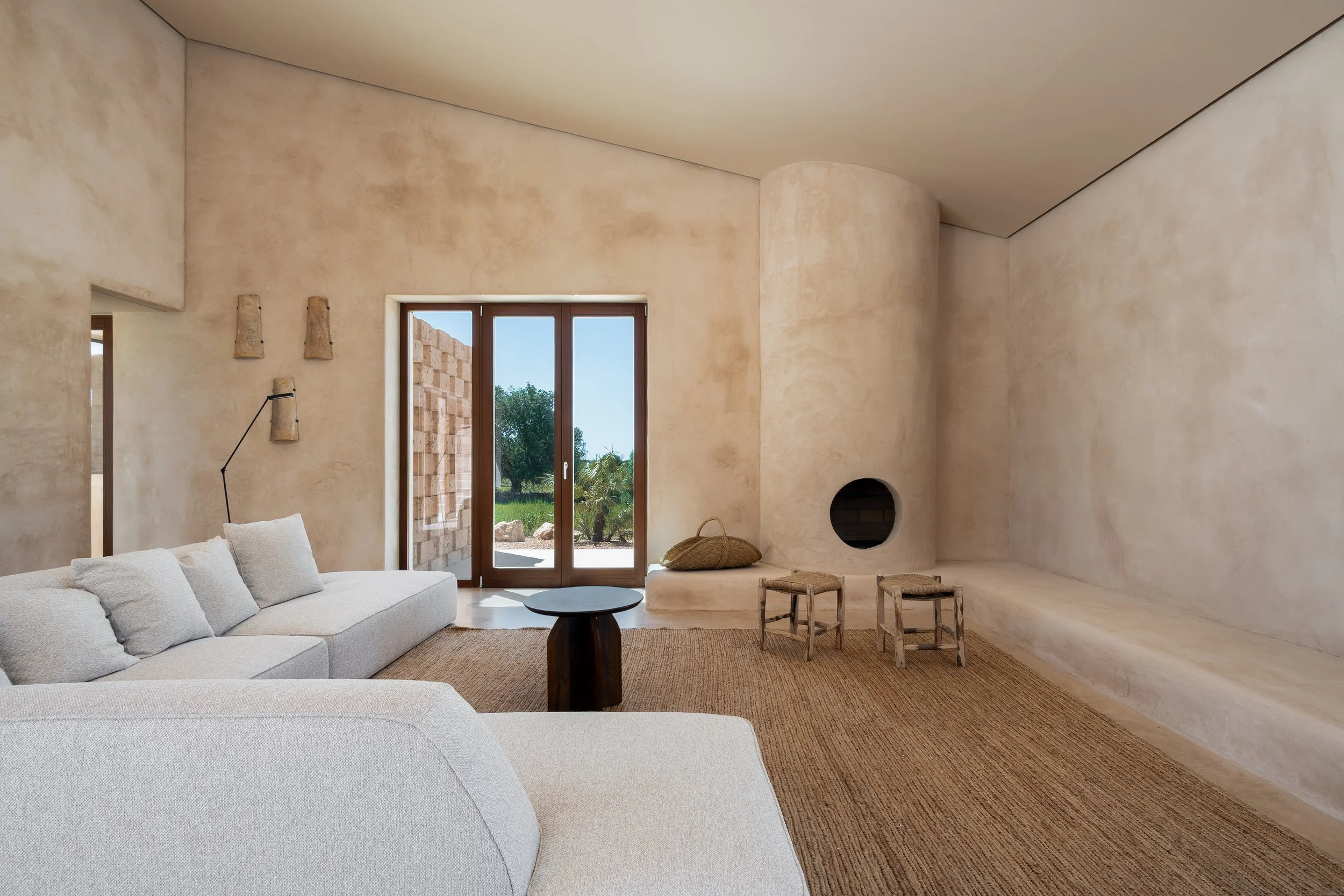 Open-plan living space with polished concrete floors and iroko joinery, Cas Concos finca Mallorca