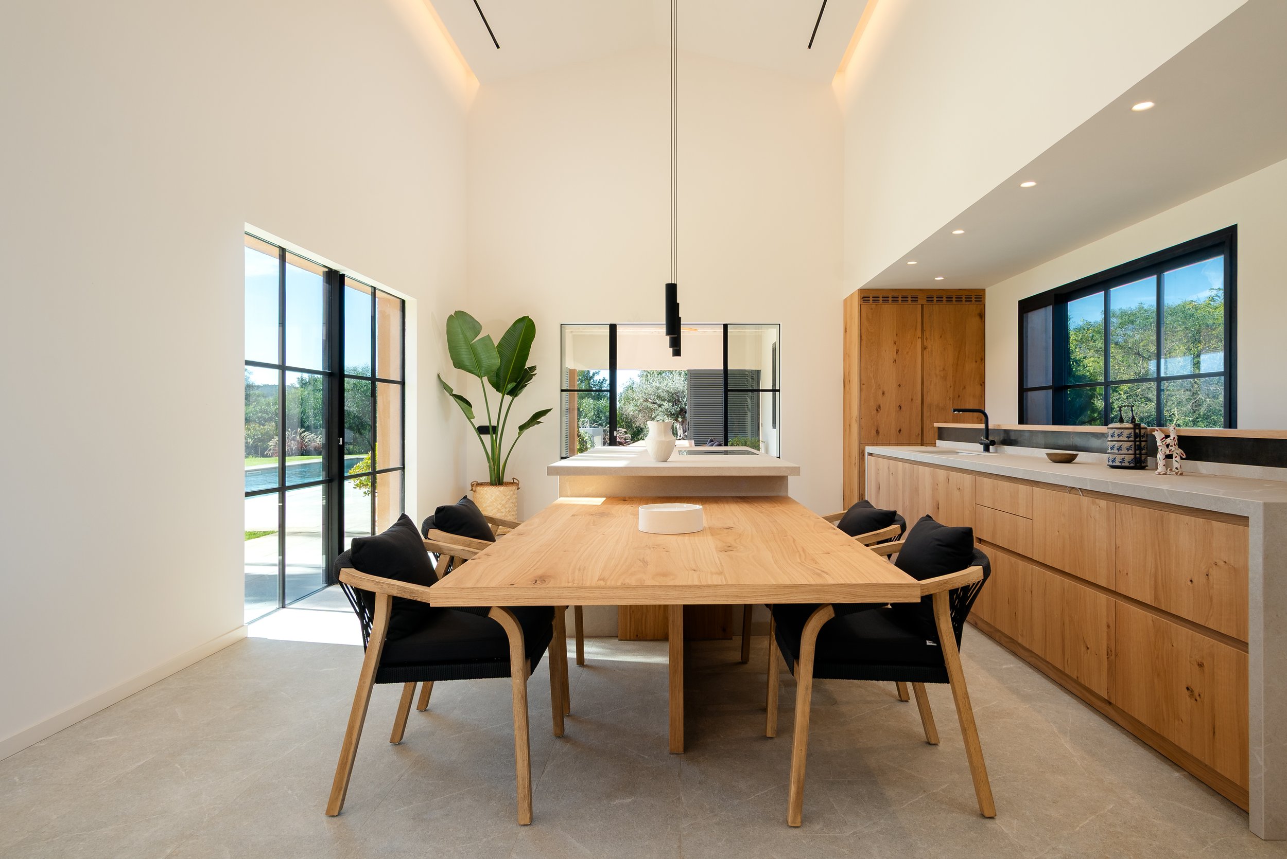Sun-filled entrance hall with solid oak door and Crittall glass, Mallorca residential architecture