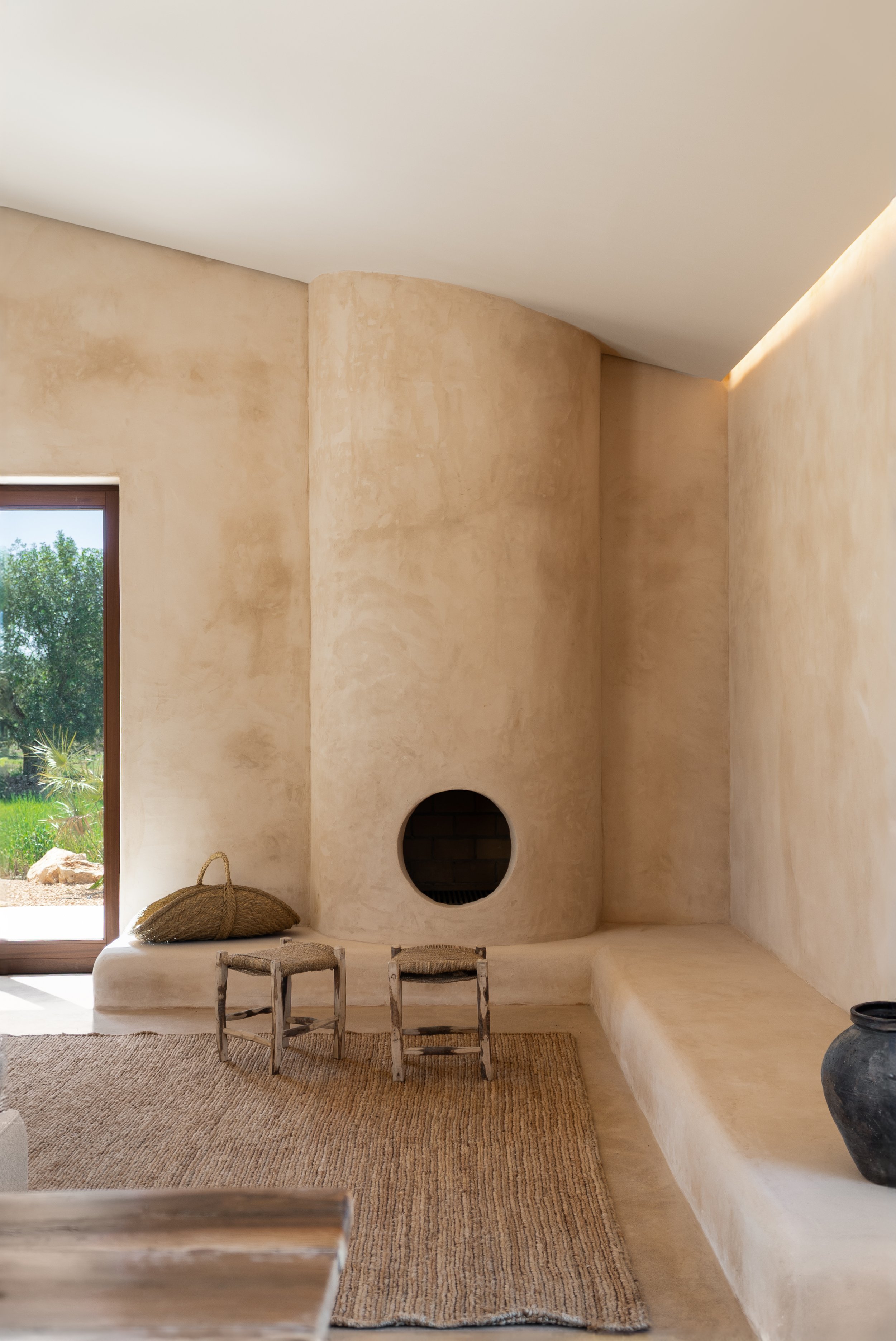 Open-plan living space with polished concrete floors and iroko joinery, Cas Concos finca Mallorca