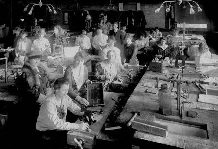 Students in the first Ward Aides Course, learning to do carpentry in the Mining Building at U of T