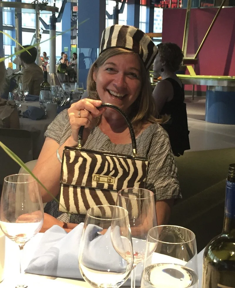 U of T's Dr Heather Colquhoun modeling the COTF Auction item that everyone wants at the 2018 CAOT Conference. 