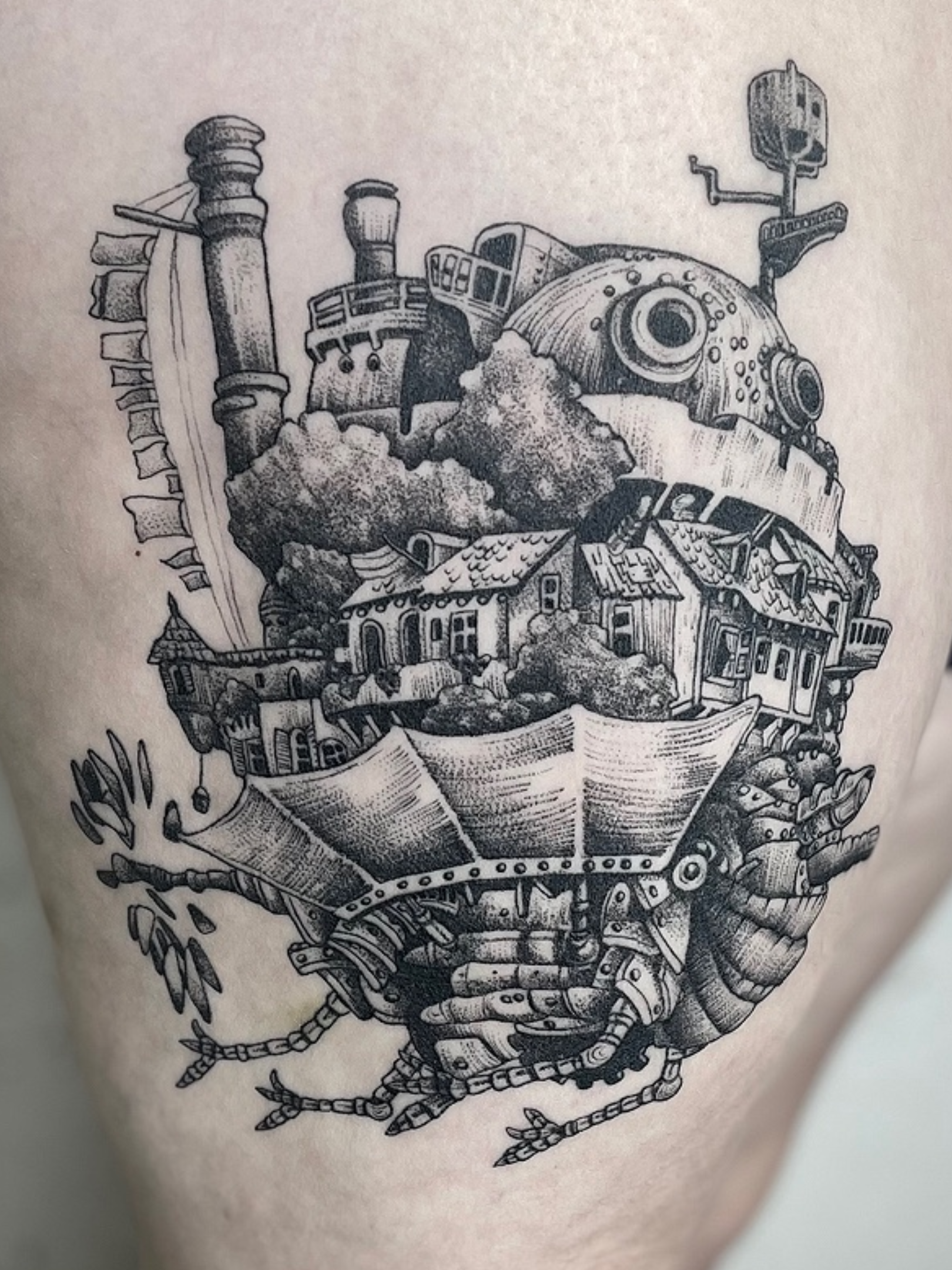 A detailed black and white illustration of a mechanical walking castle with a cityscape integrated into its body, featuring buildings, houses, and industrial elements.
